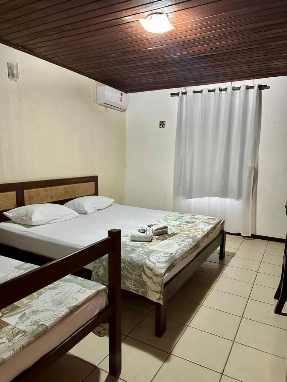 Bed in Pousada Navegantes Beach