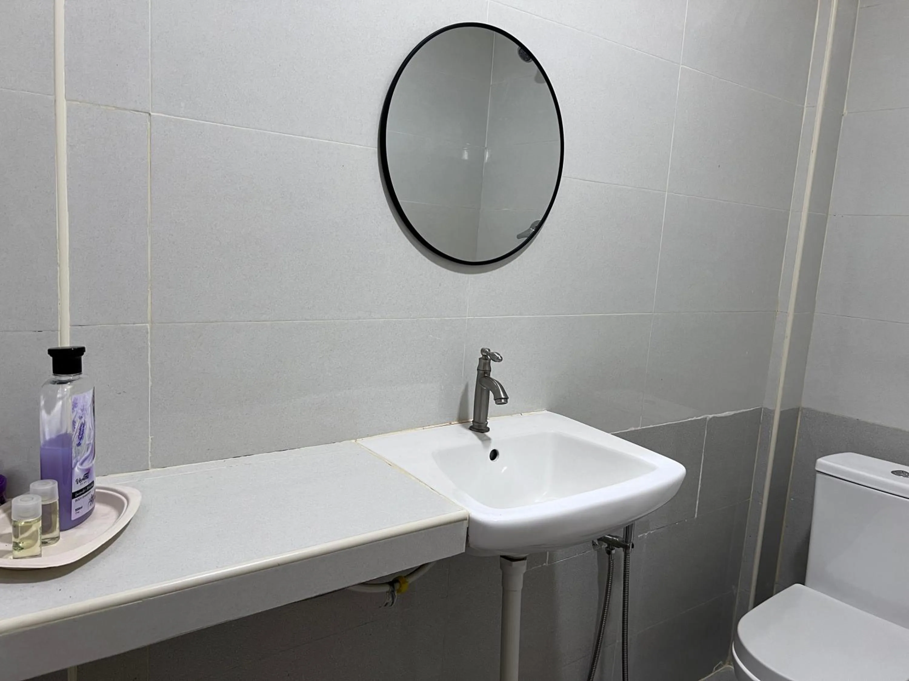 Bathroom in Hotel O Sri Ayu Inn