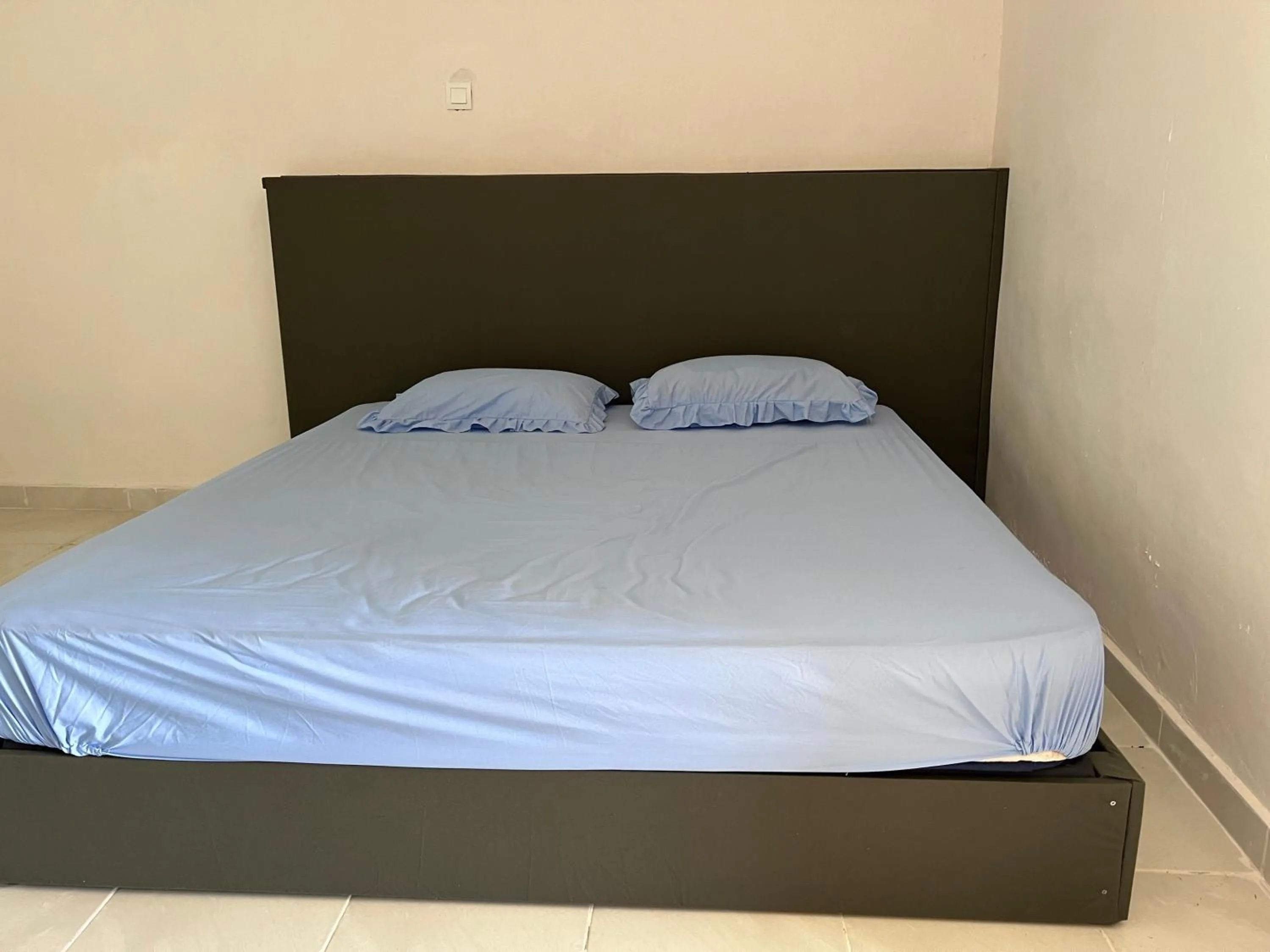 Bedroom in Hotel O Sri Ayu Inn