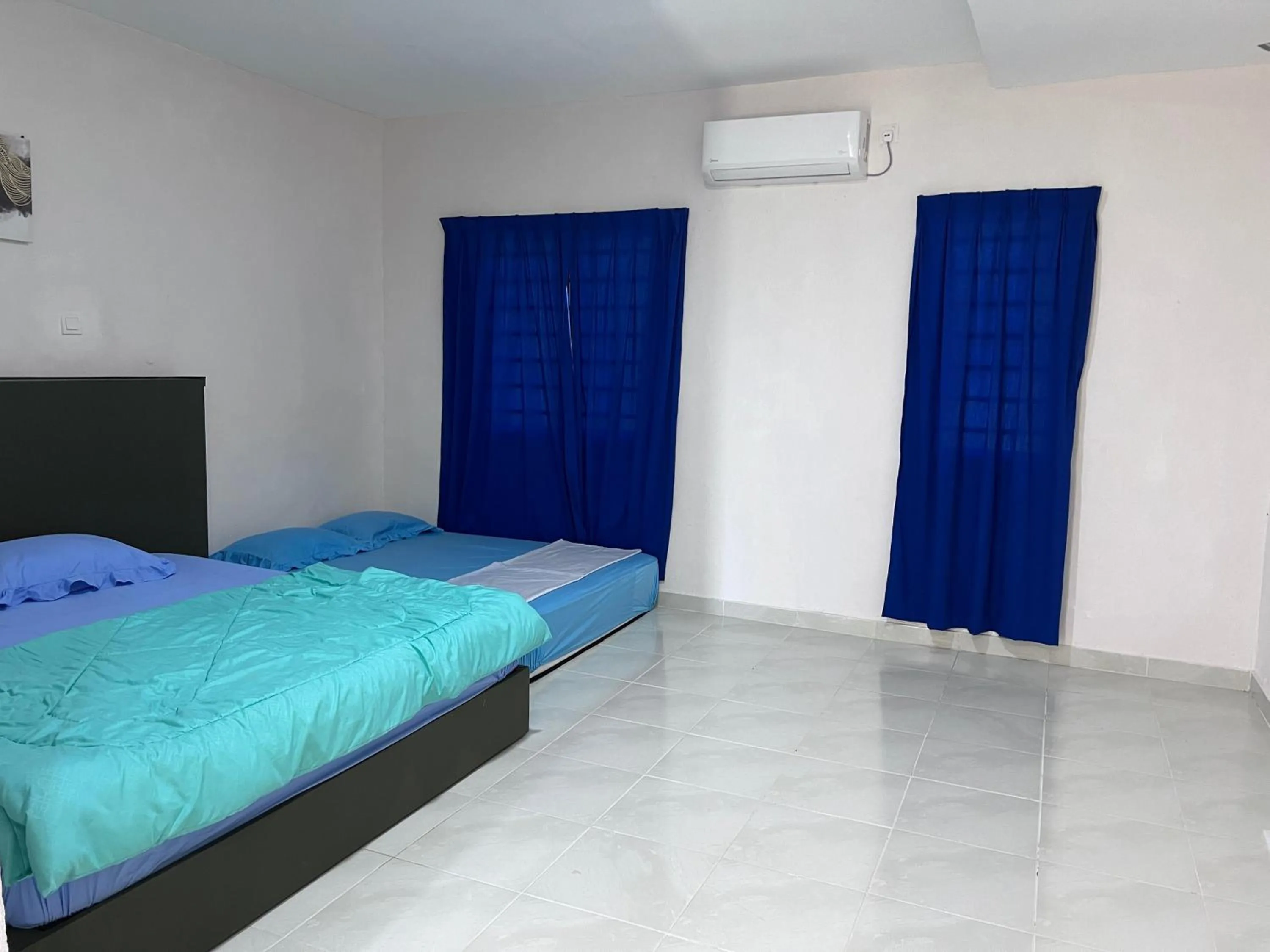 Bedroom in Hotel O Sri Ayu Inn