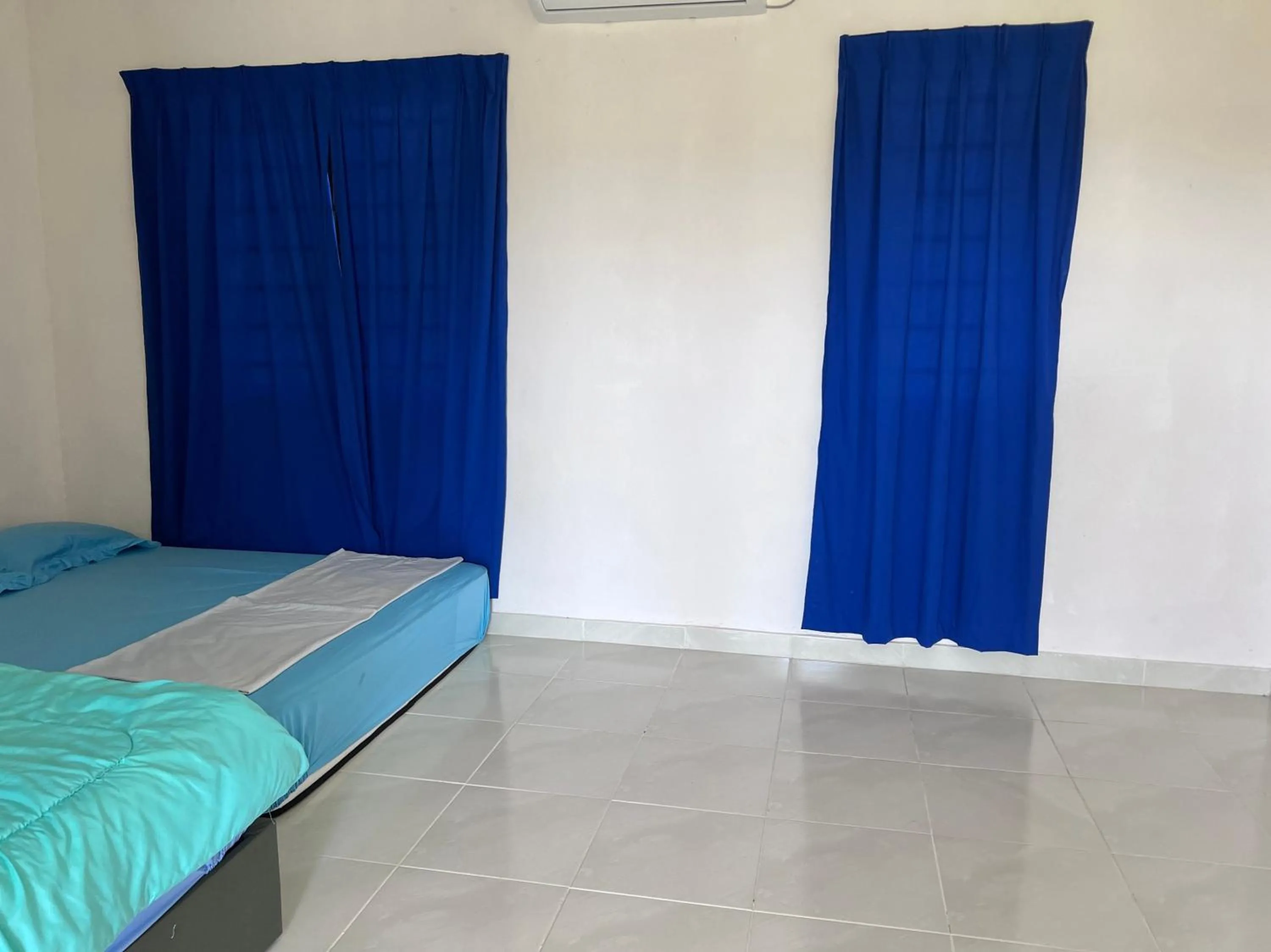 Bedroom in Hotel O Sri Ayu Inn