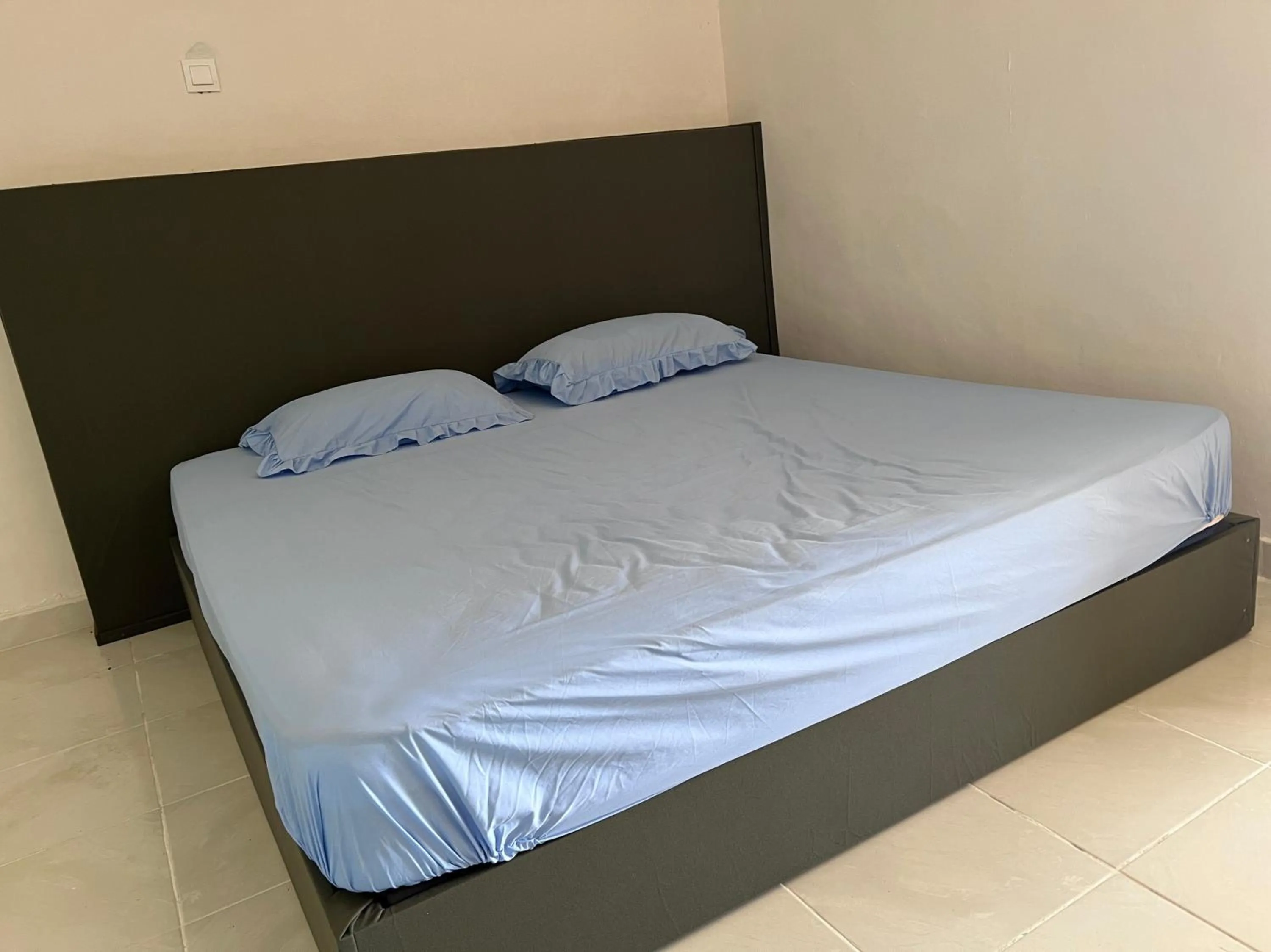 Bedroom in Hotel O Sri Ayu Inn