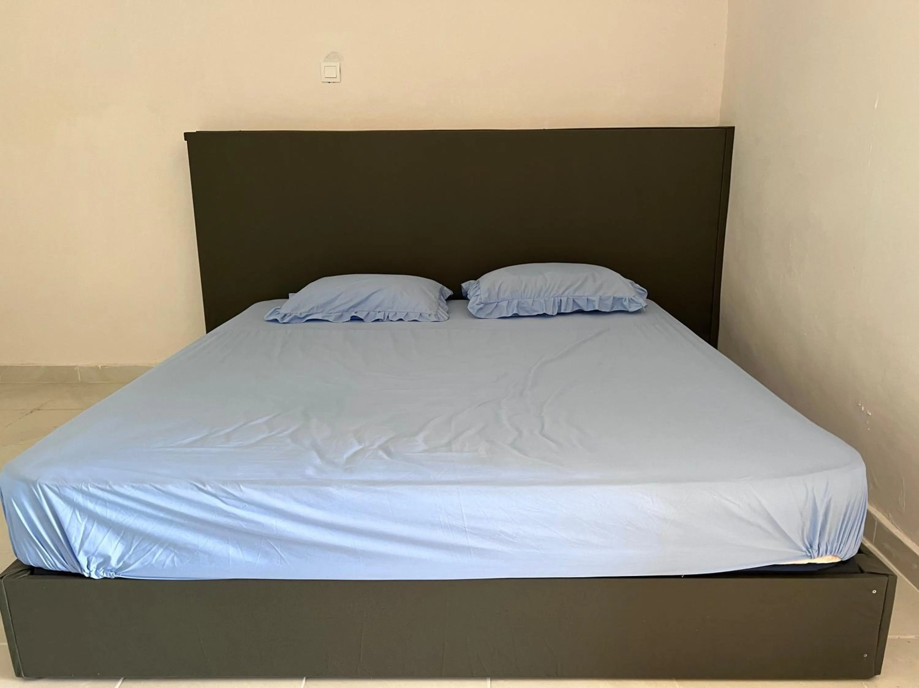 Bedroom in Hotel O Sri Ayu Inn