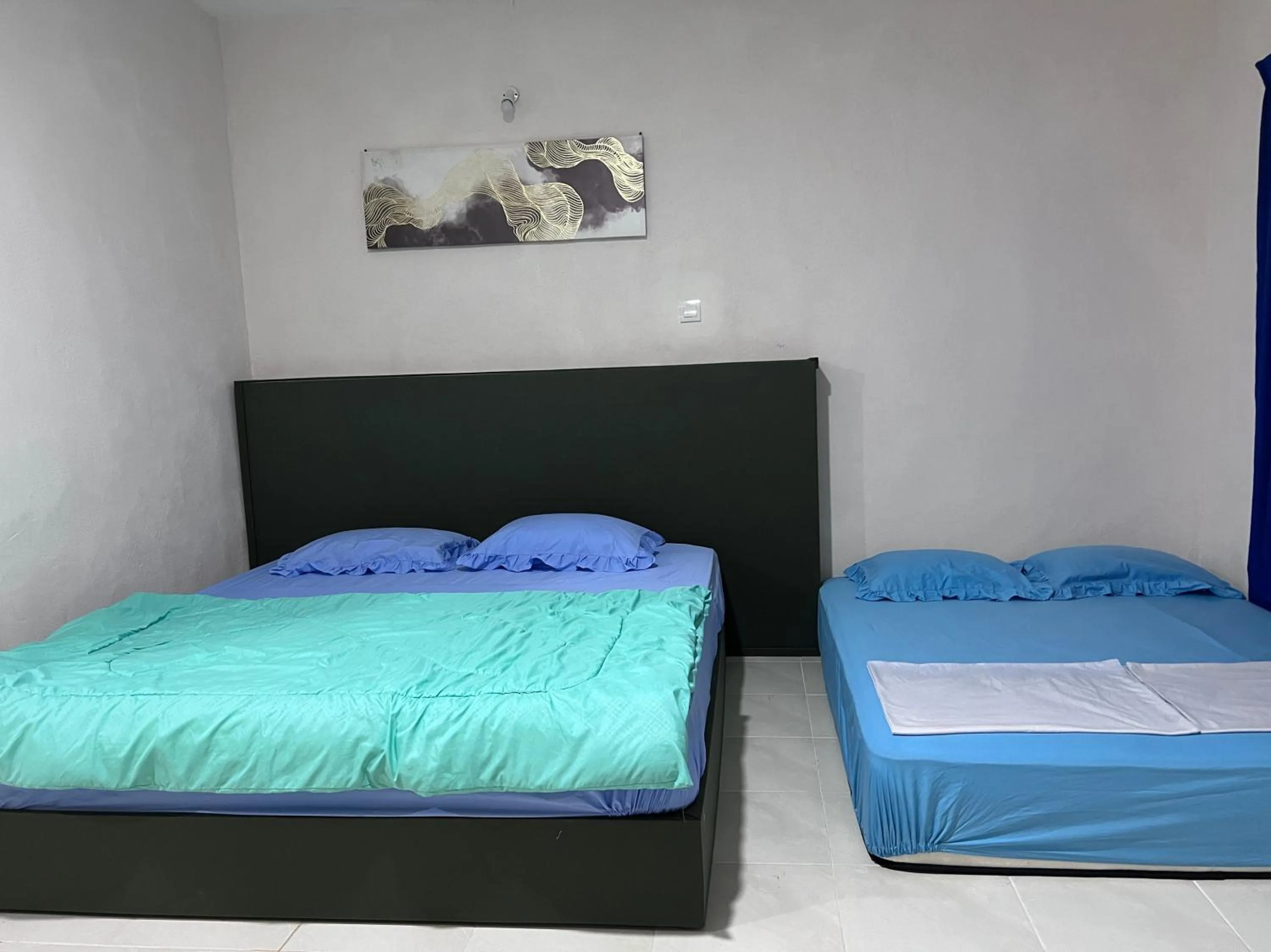 Bedroom in Hotel O Sri Ayu Inn