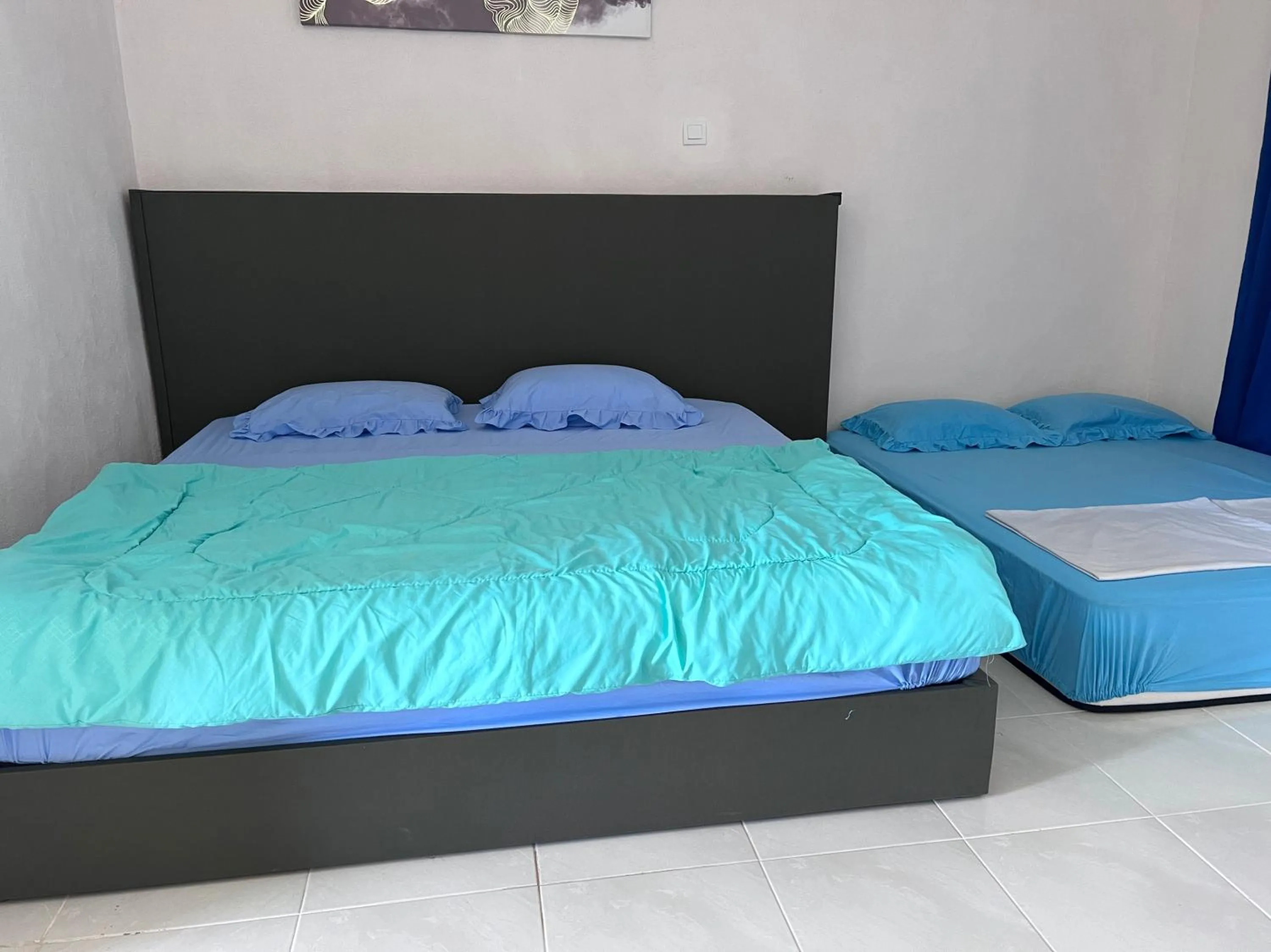 Bedroom in Hotel O Sri Ayu Inn