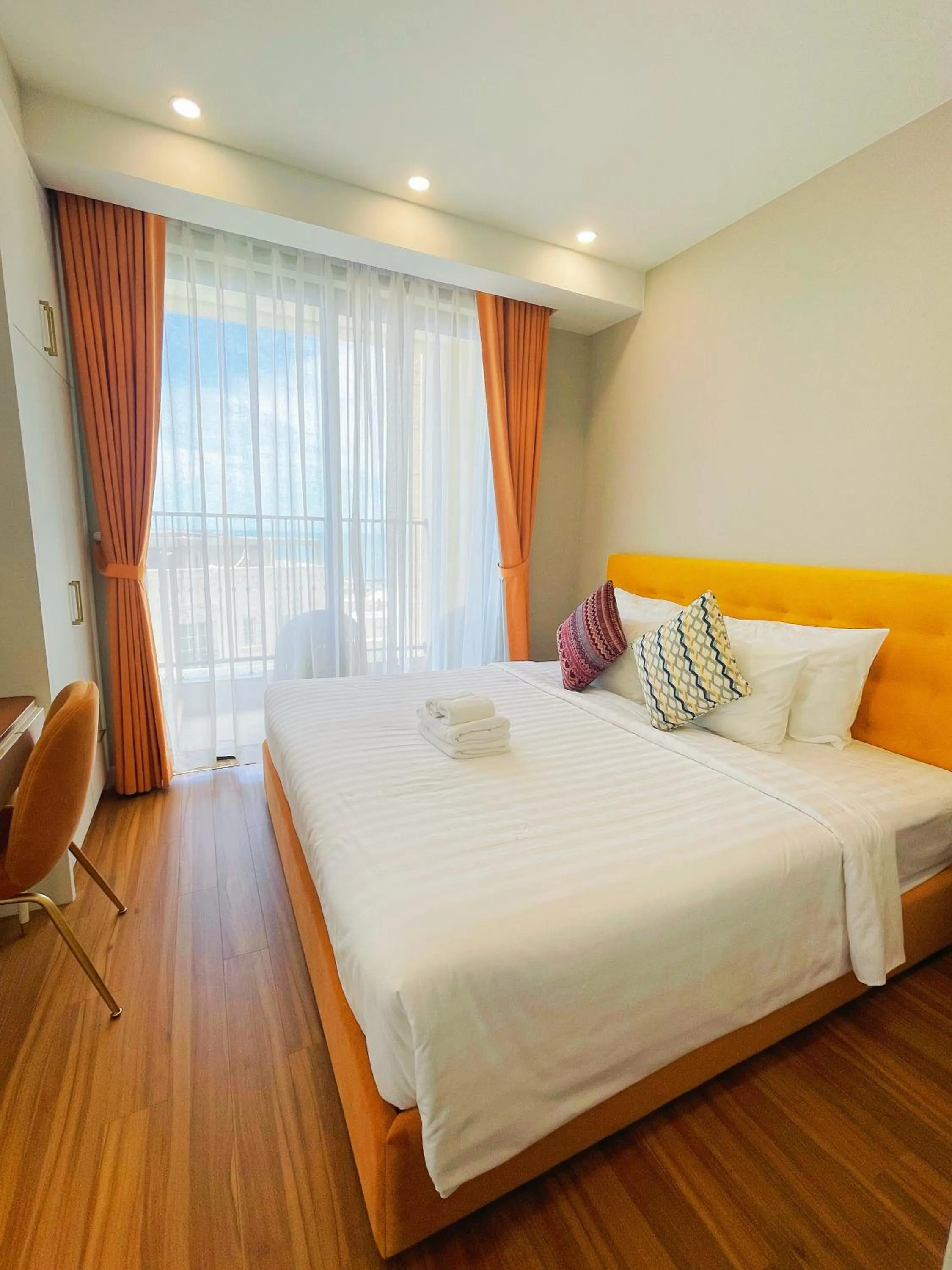 Bedroom, Bed in We Young Apartments by HOFs - Fireworks & Ocean view