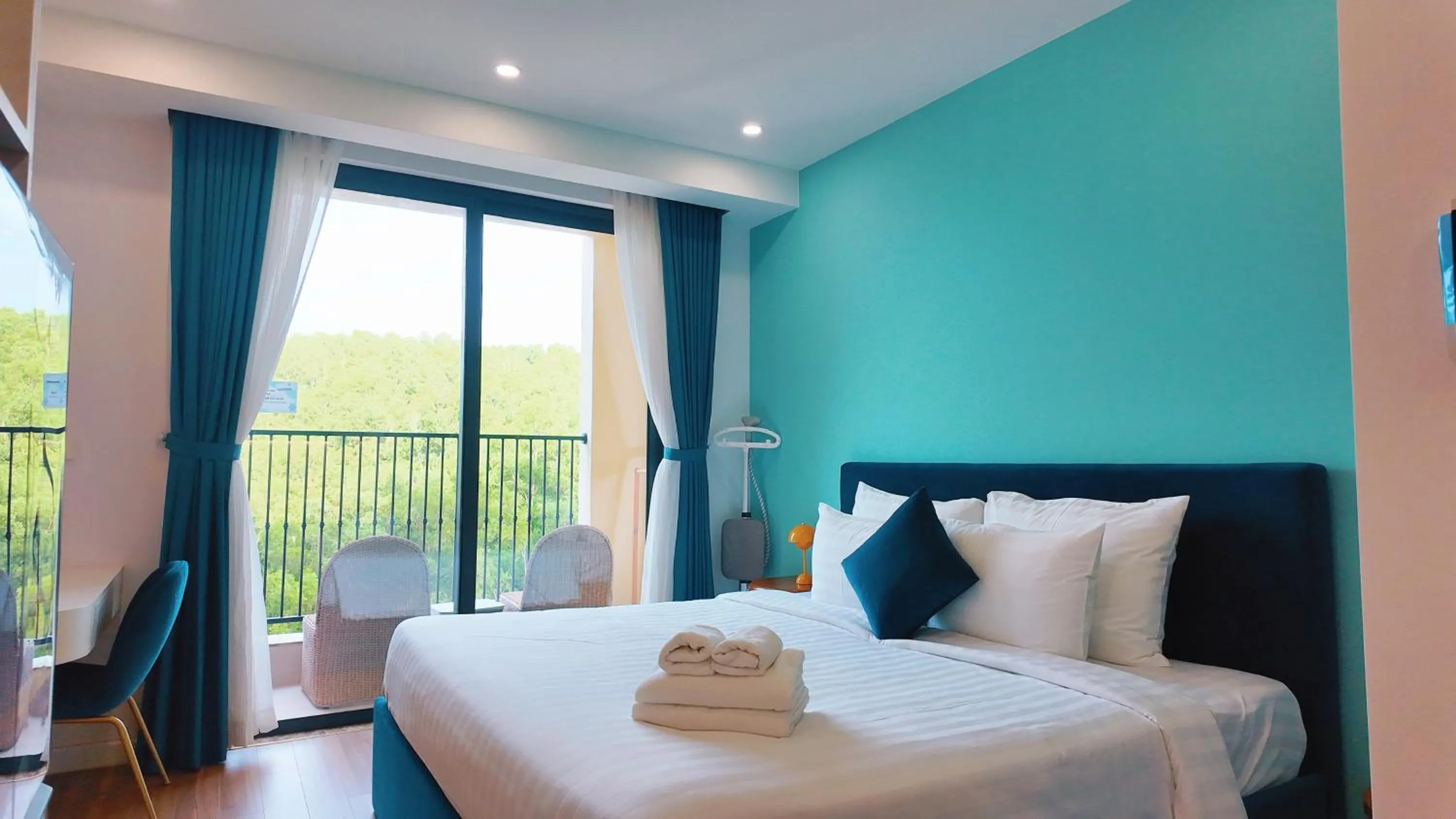 Bedroom, Bed in We Young Apartments by HOFs - Fireworks & Ocean view