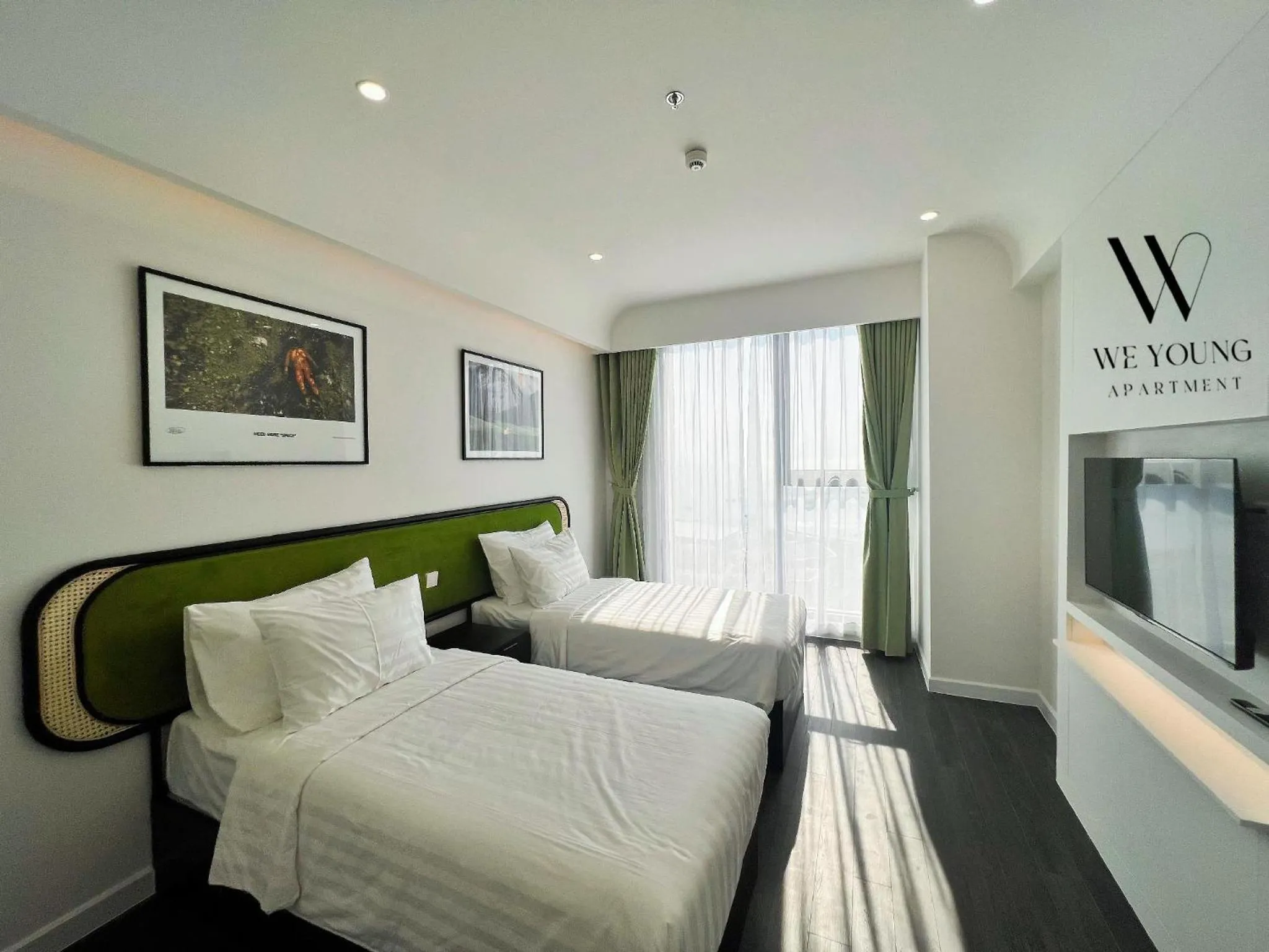 Bed in We Young Apartments by HOFs - Fireworks & Ocean view