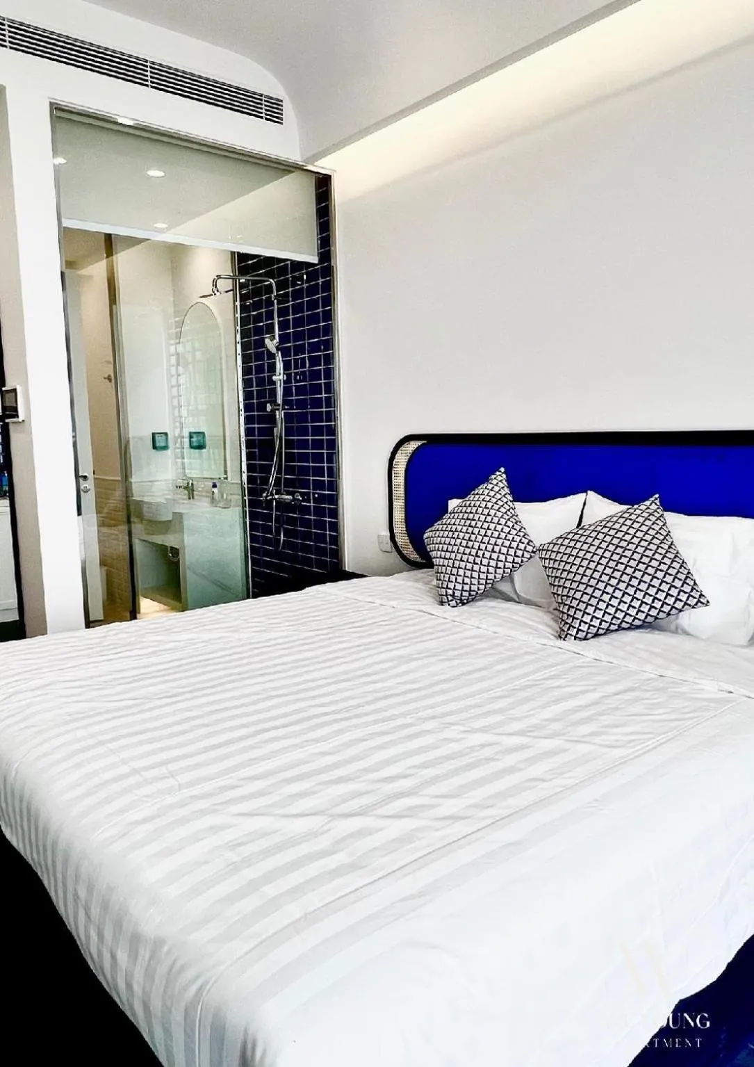 Bedroom, Bed in We Young Apartments by HOFs - Fireworks & Ocean view