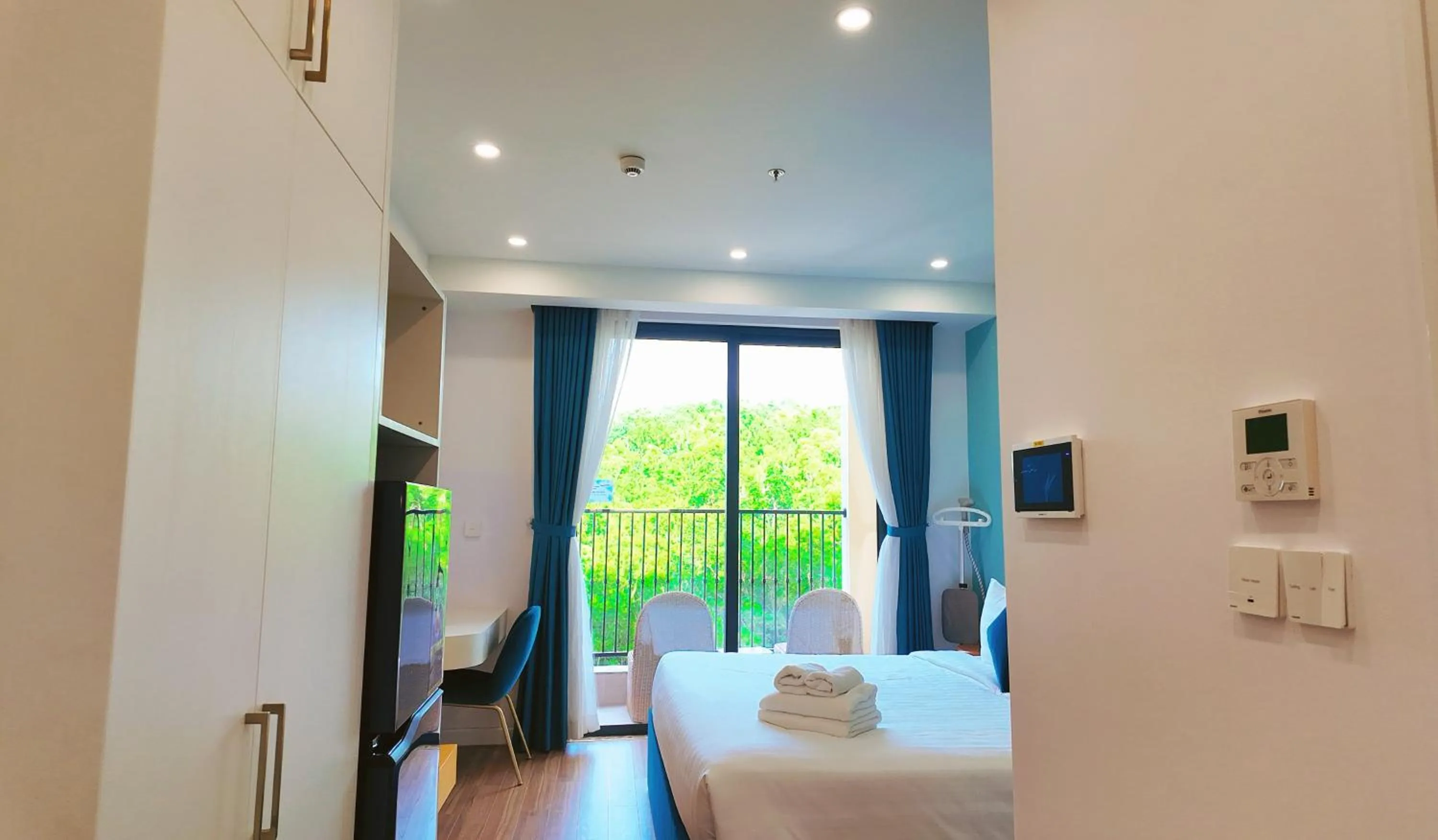 Bed in We Young Apartments by HOFs - Fireworks & Ocean view