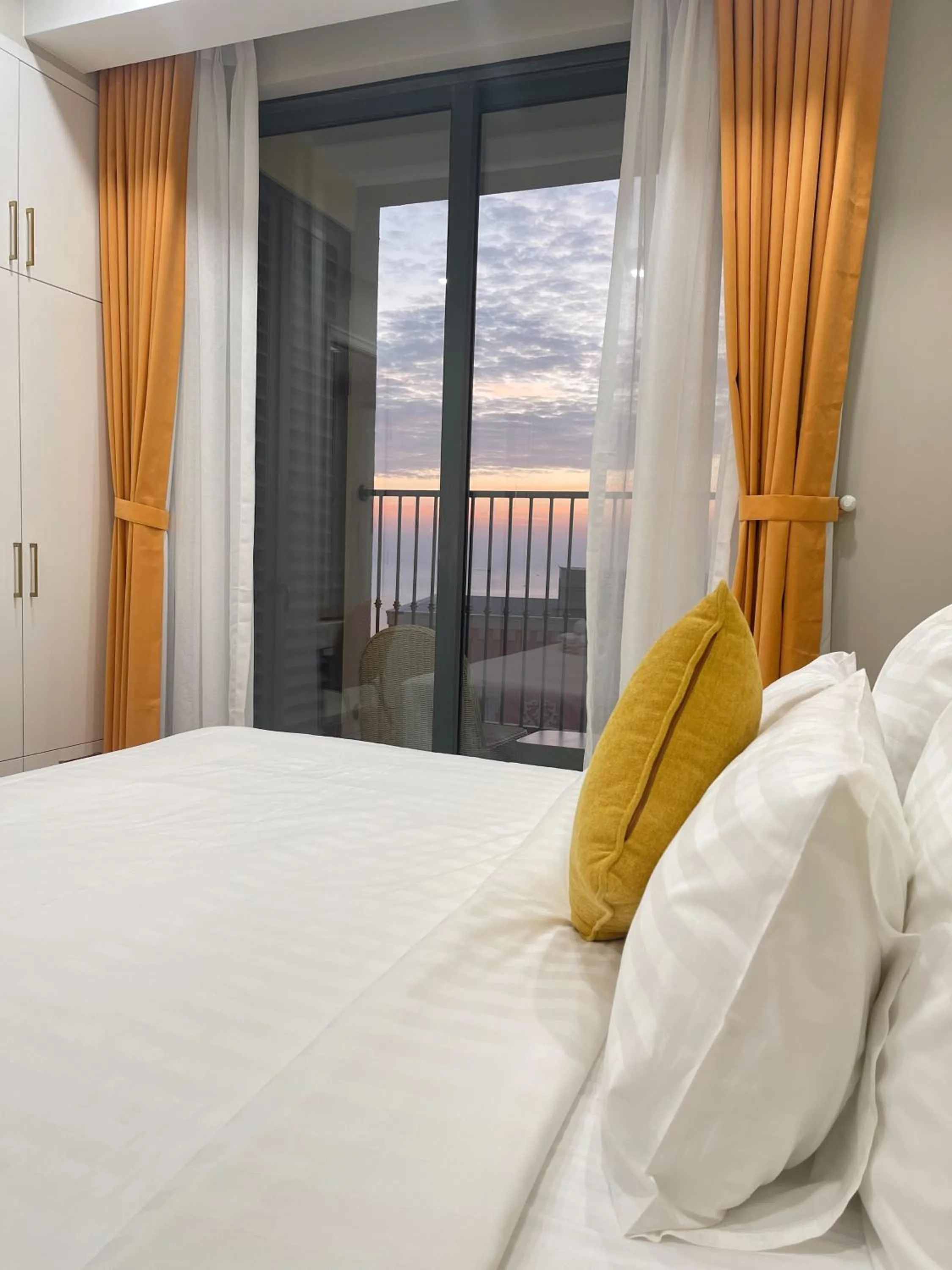 Bed in We Young Apartments by HOFs - Fireworks & Ocean view