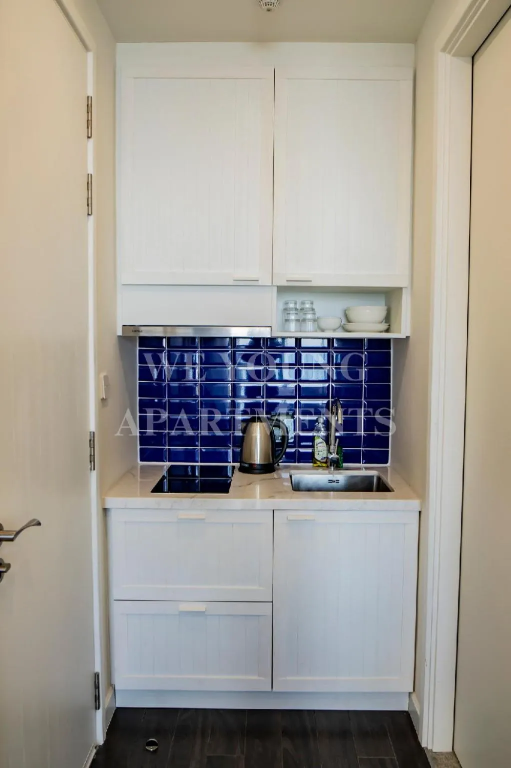 stove in We Young Apartments by HOFs - Fireworks & Ocean view