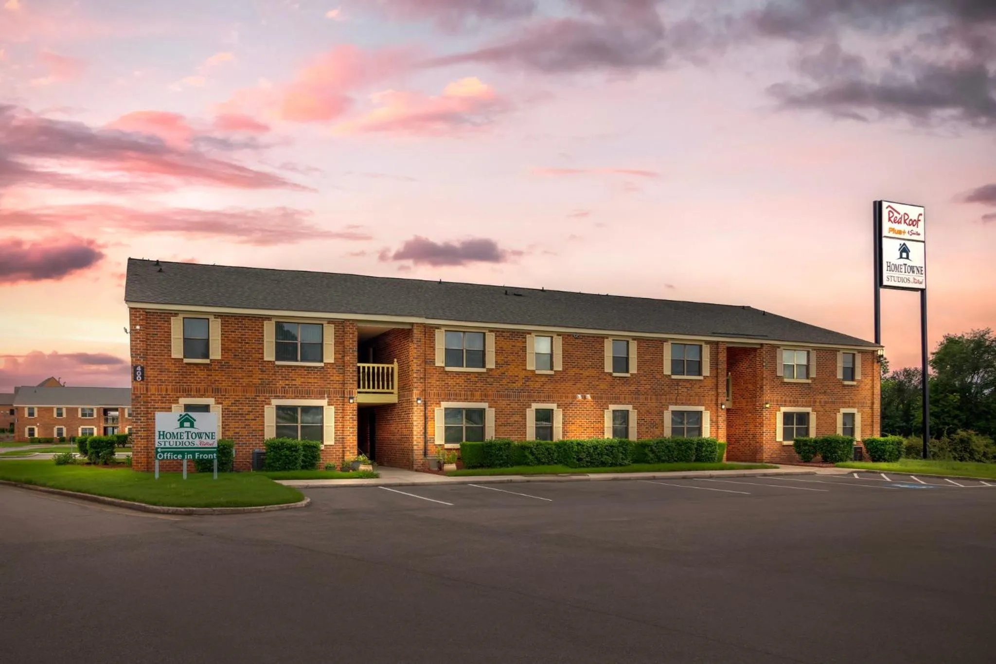 Property building in HomeTowne Studios by Red Roof Huntsville - Madison