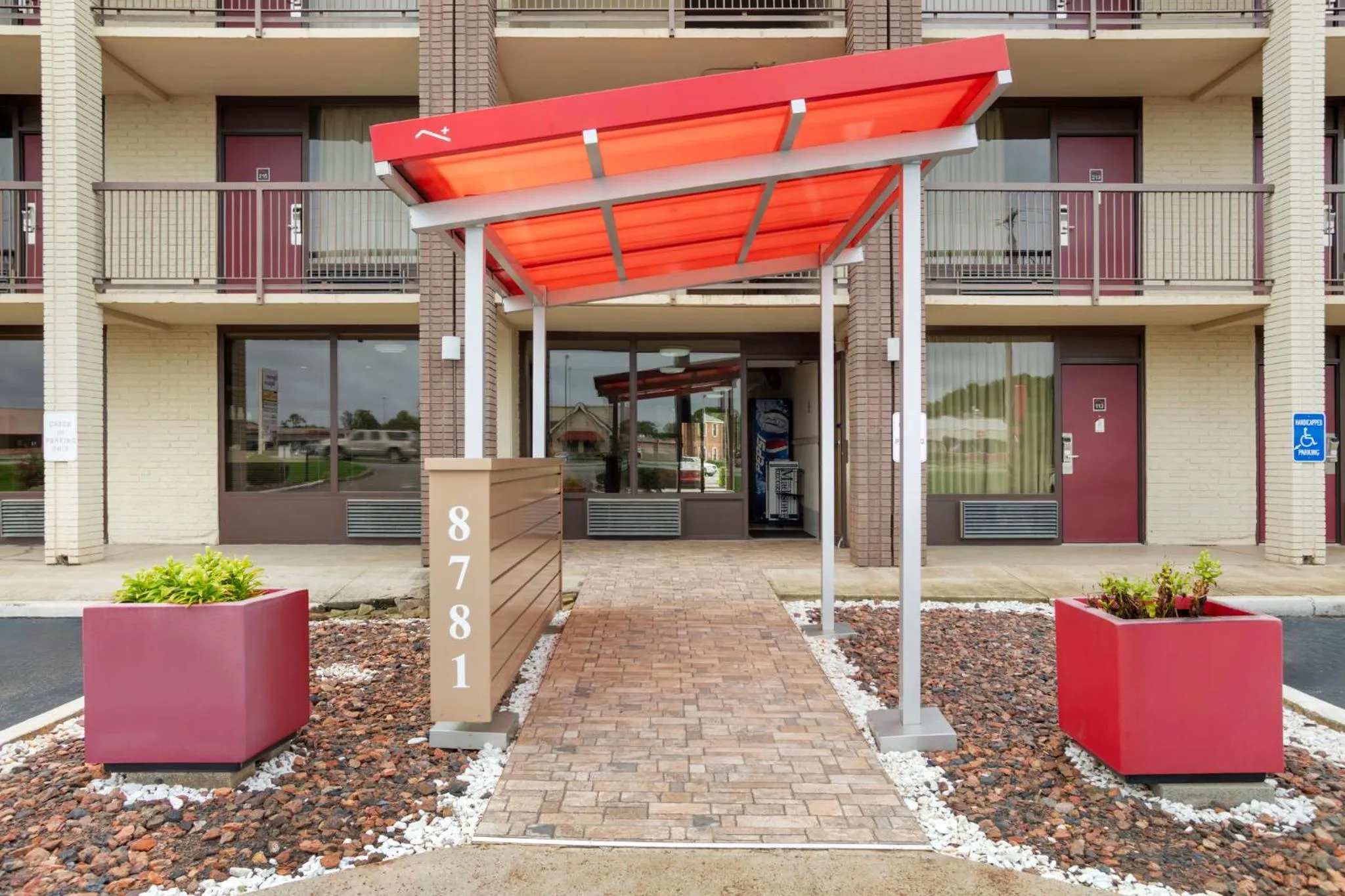 Property building in HomeTowne Studios by Red Roof Huntsville - Madison