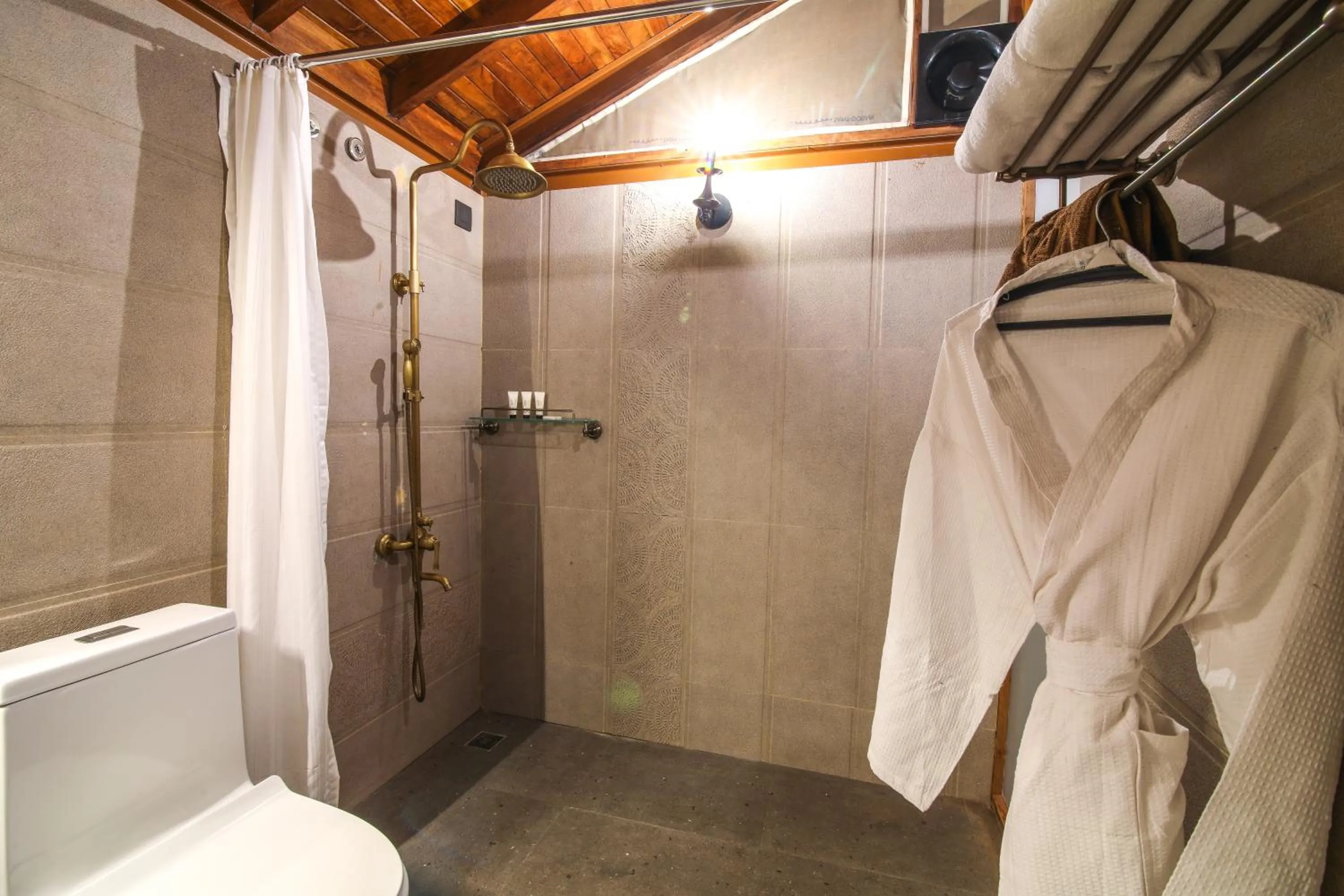 Shower in Toyam by Orchid Hotels