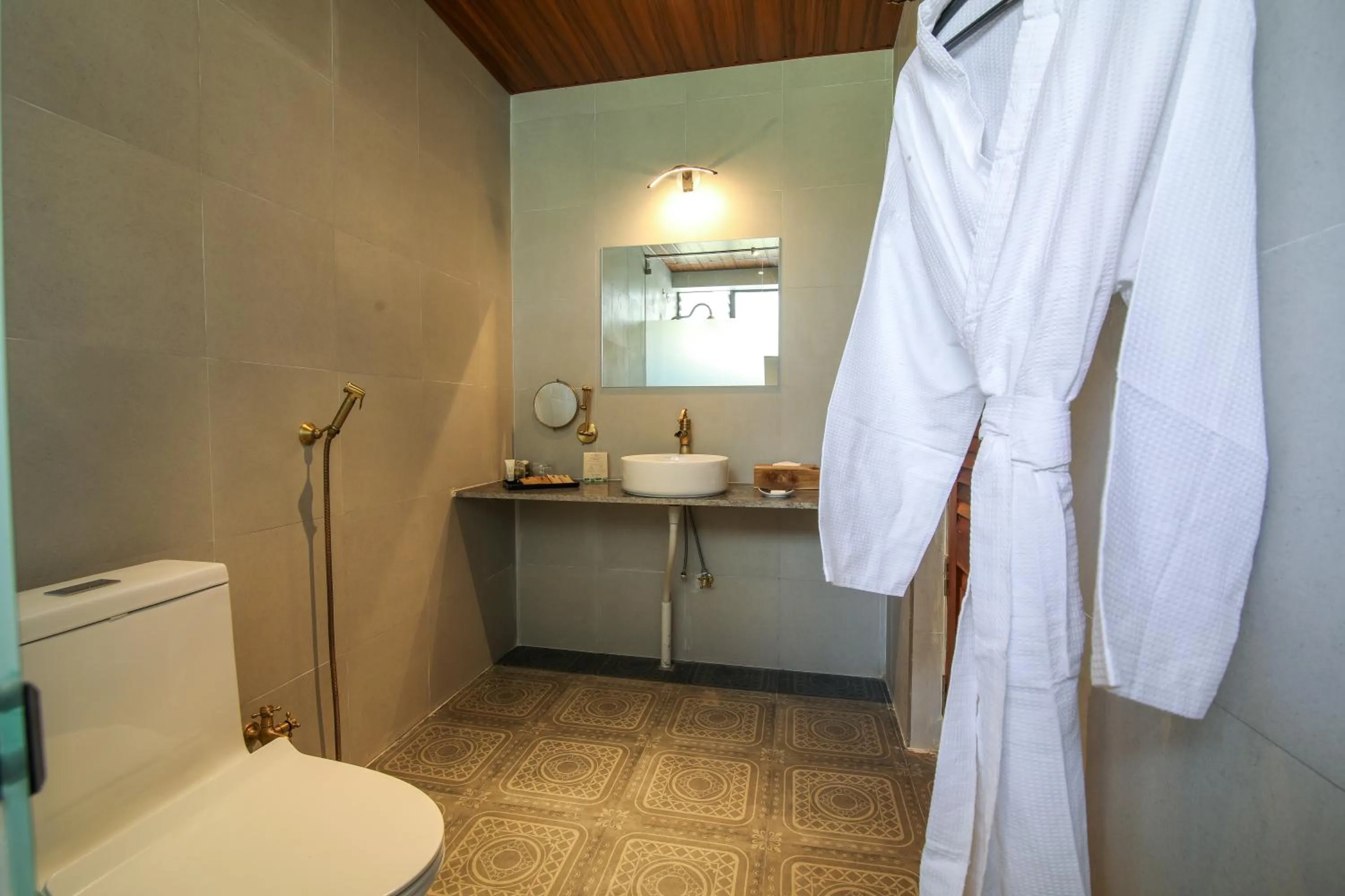 Bathroom in Toyam by Orchid Hotels