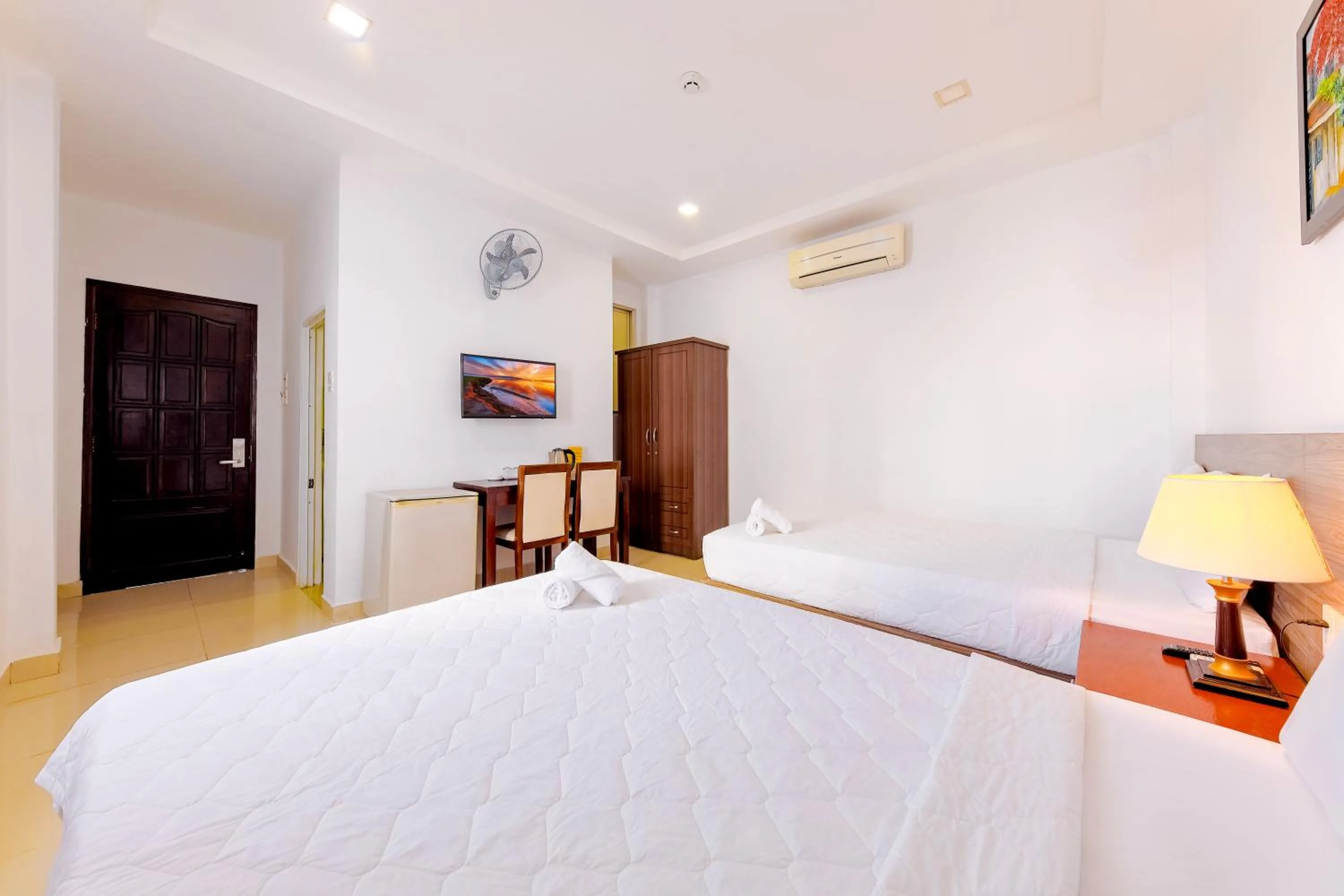 Bed in Mangolia Hotel