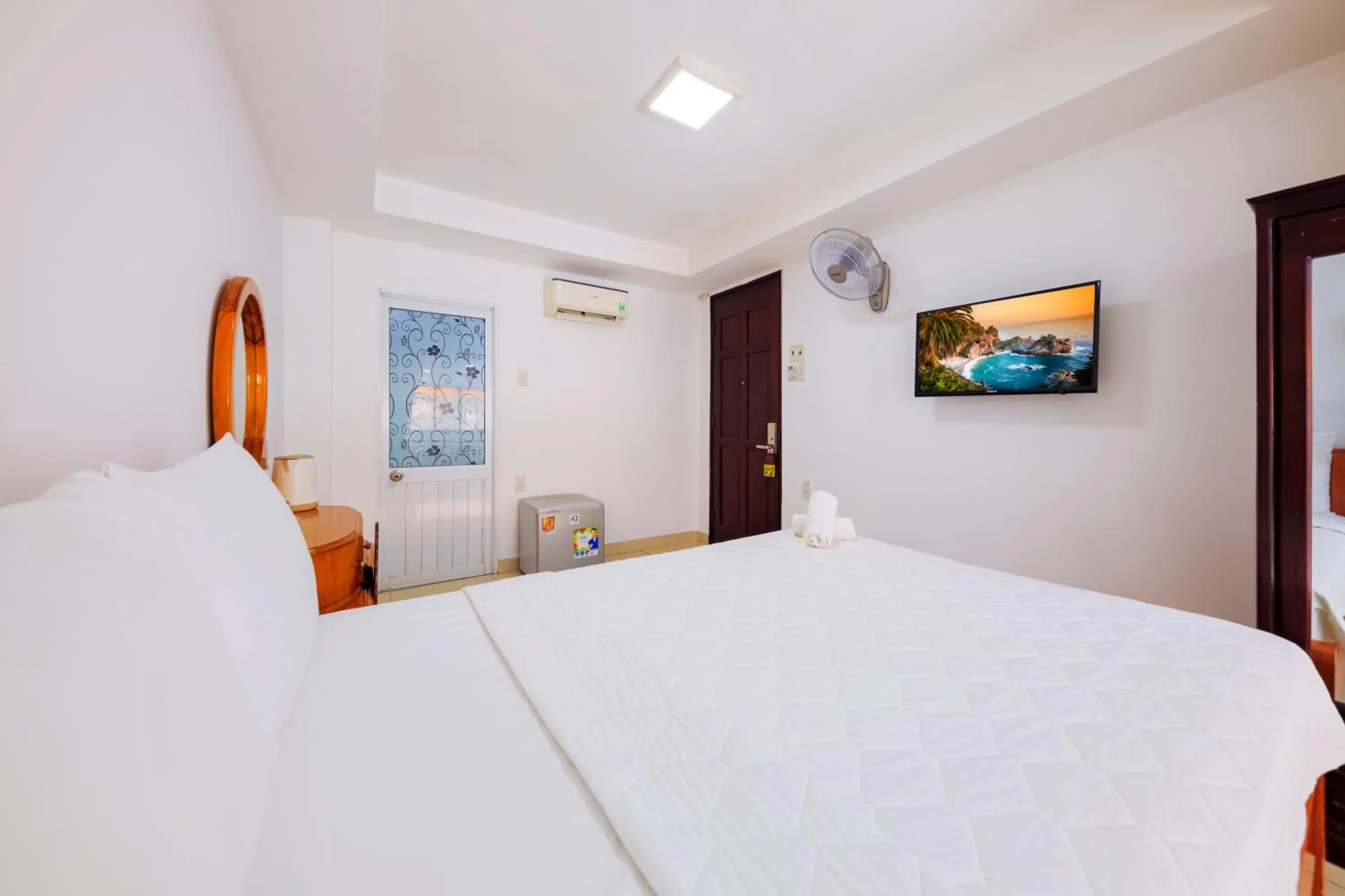 Bed in Mangolia Hotel