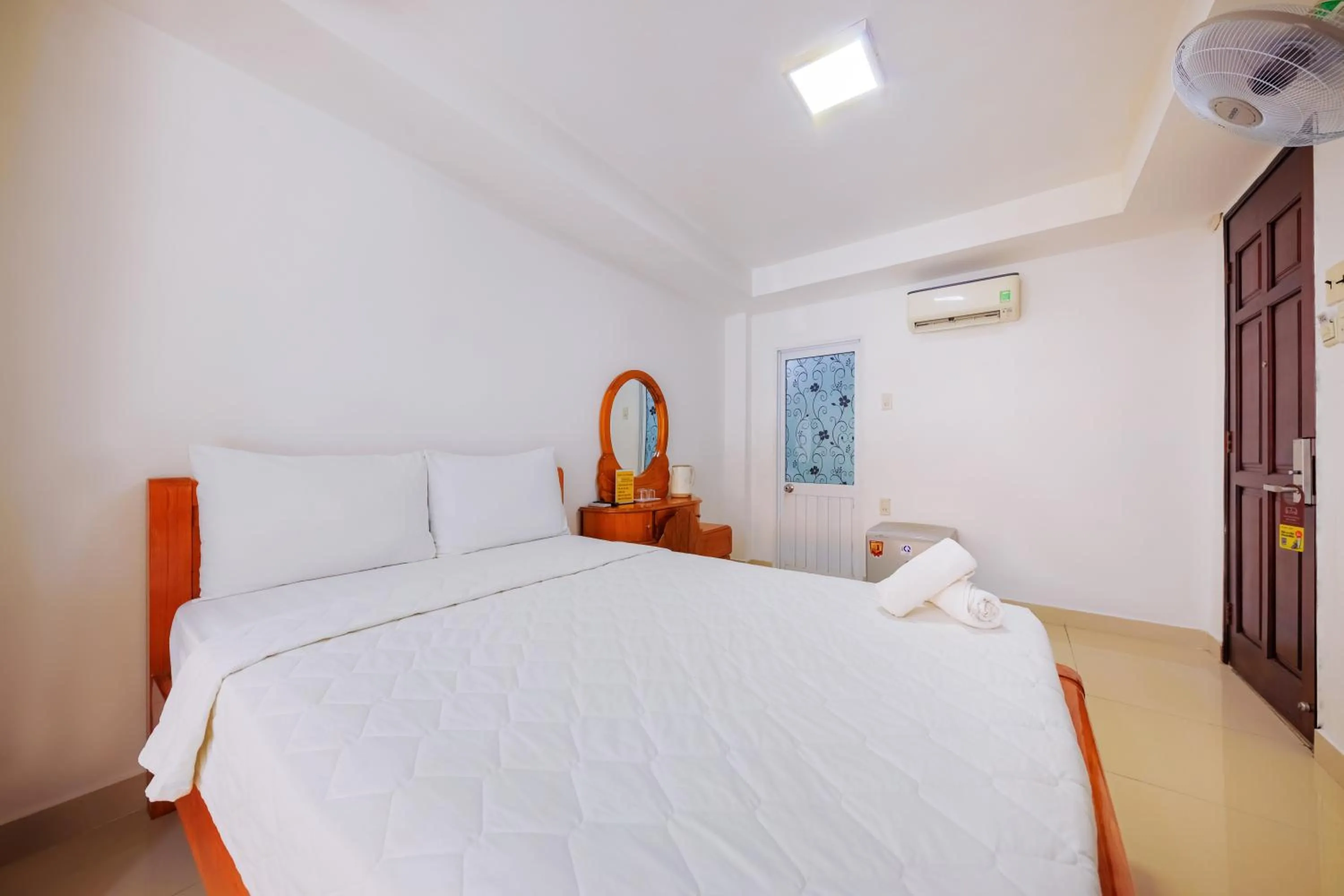 Bed in Mangolia Hotel