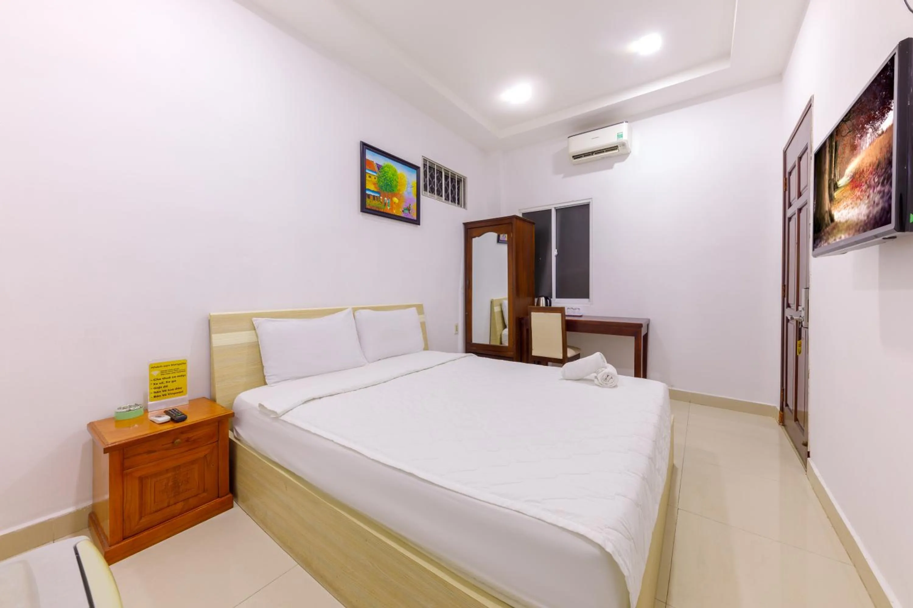 Bed in Mangolia Hotel