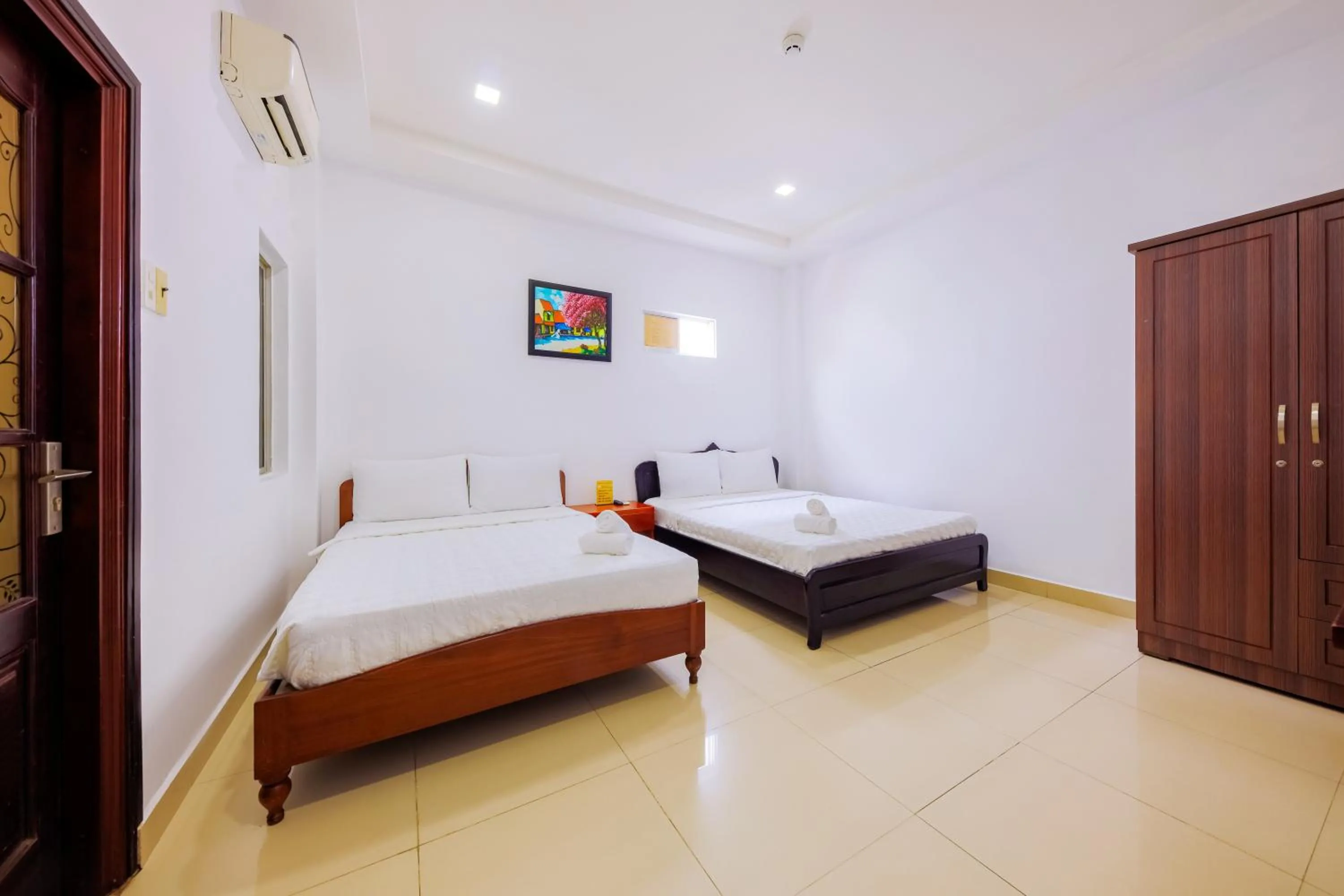 Bed in Mangolia Hotel