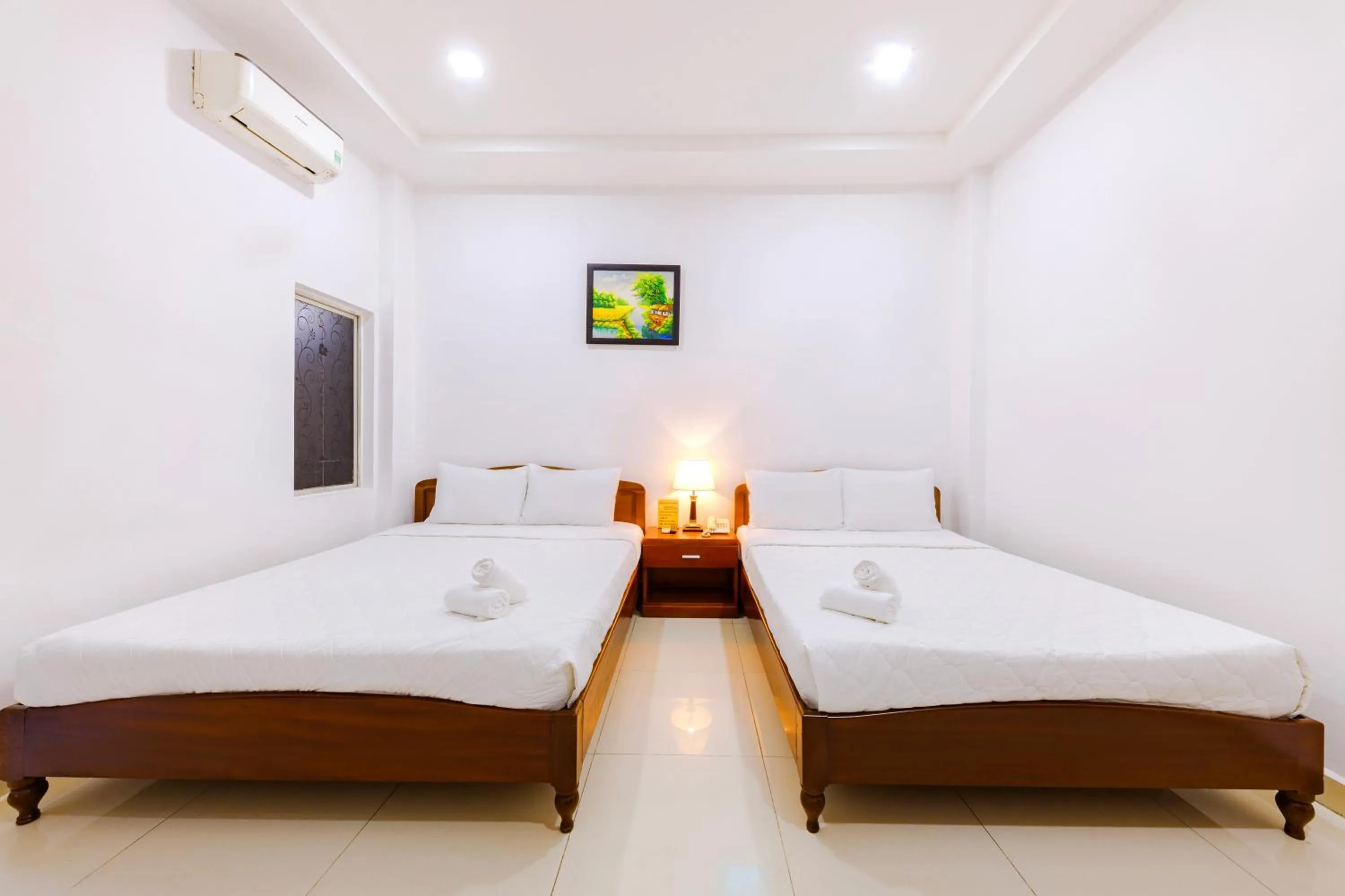 Bed in Mangolia Hotel