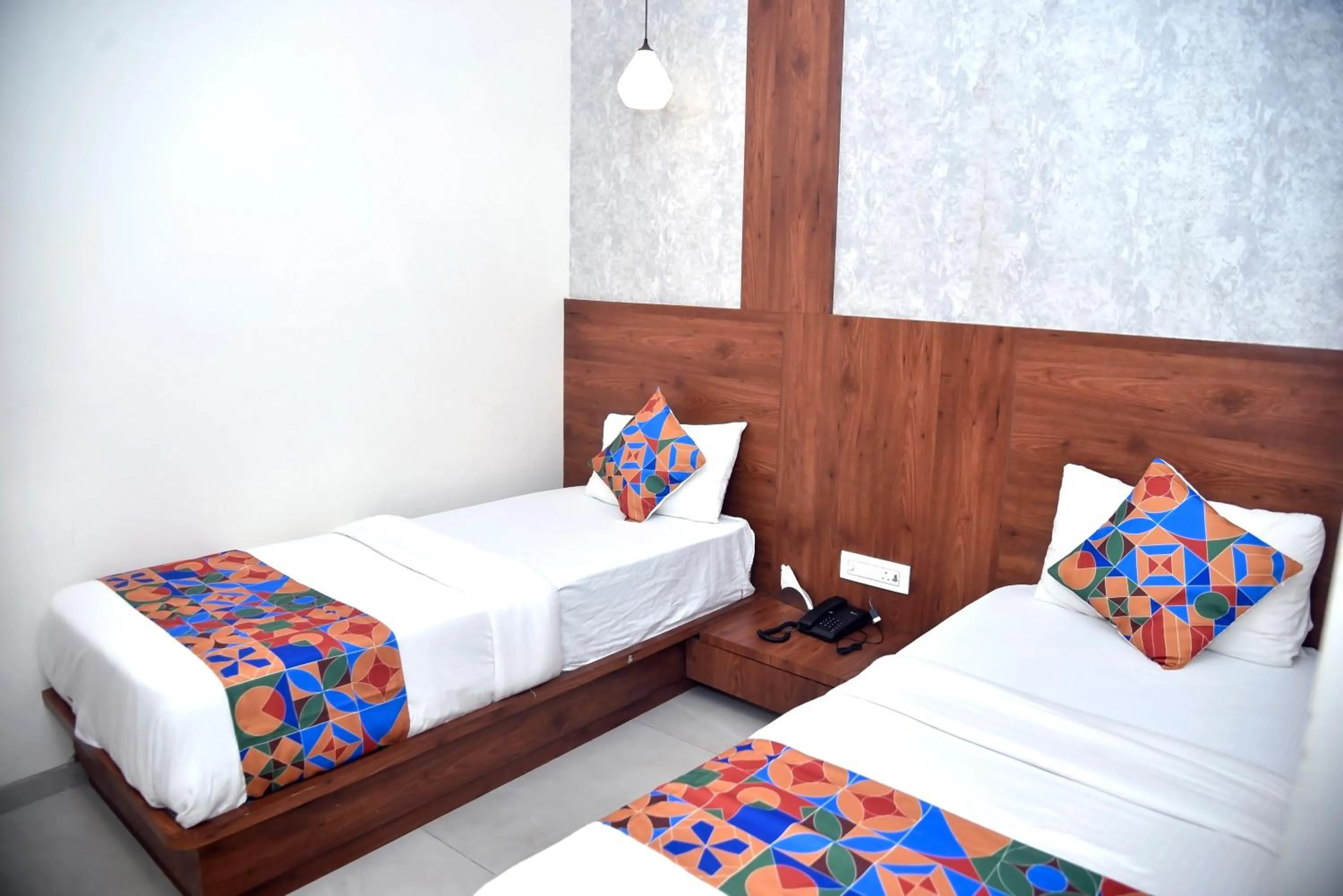 Bed in Hotel Pride Inn