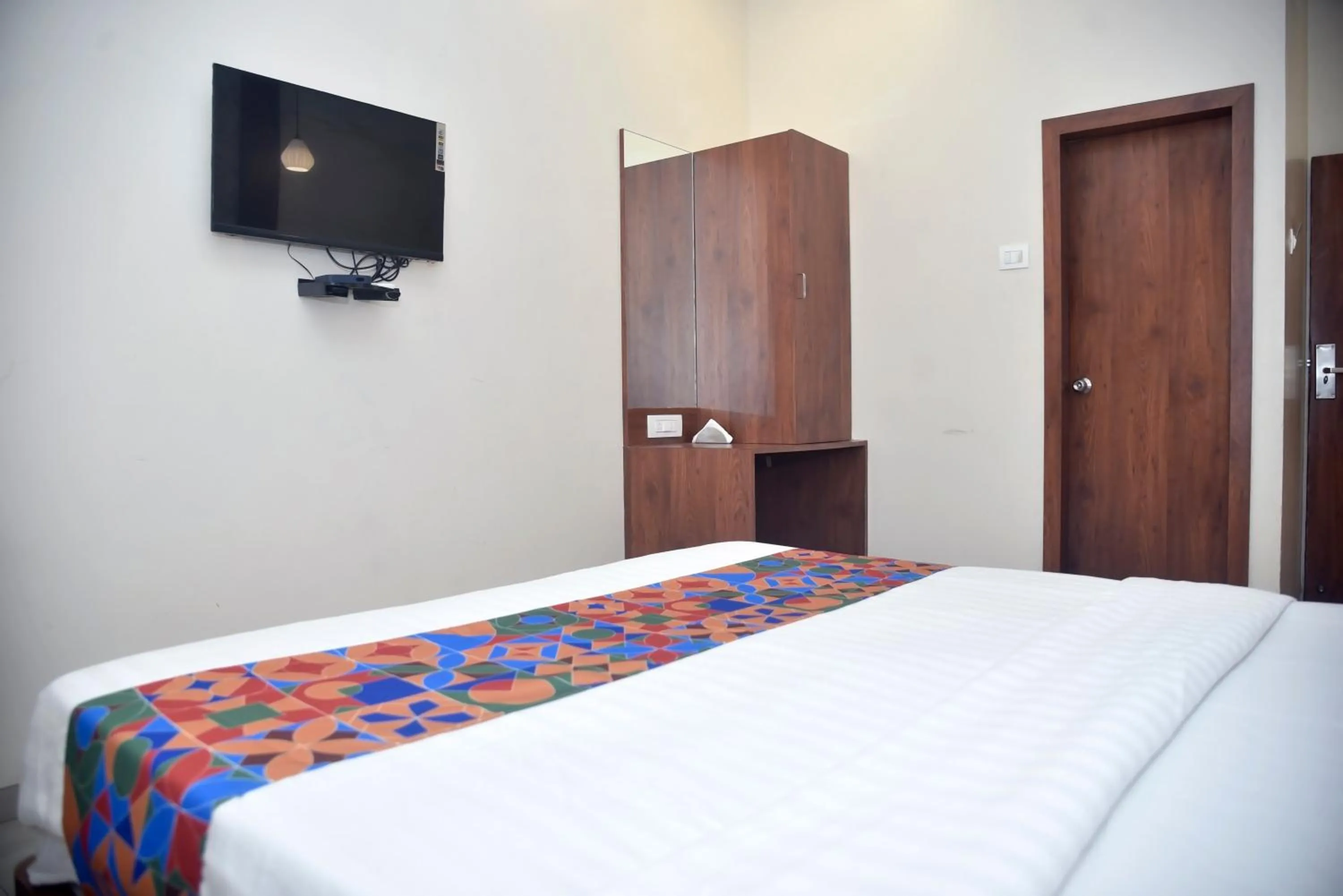 Bed in Hotel Pride Inn