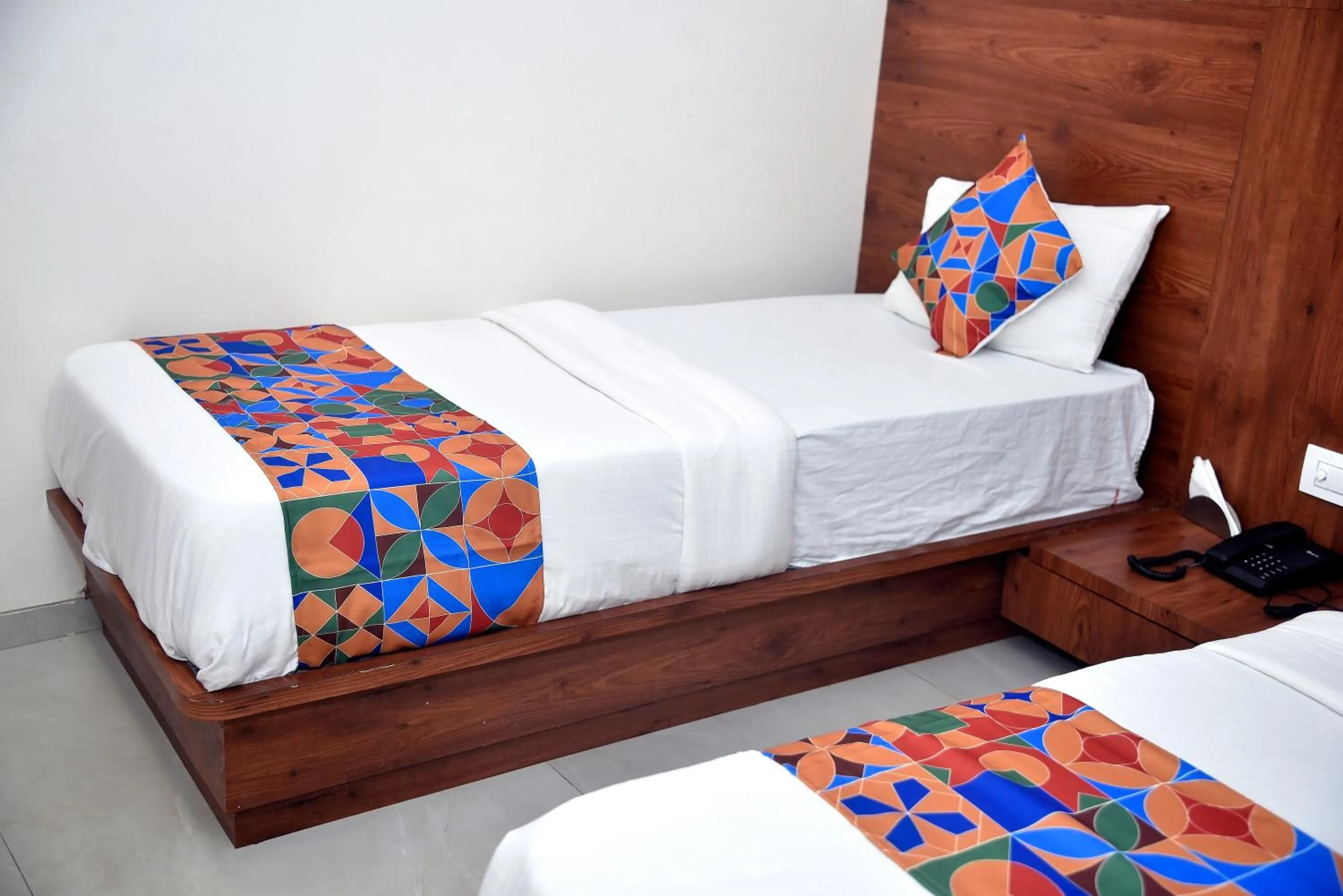 Bed in Hotel Pride Inn