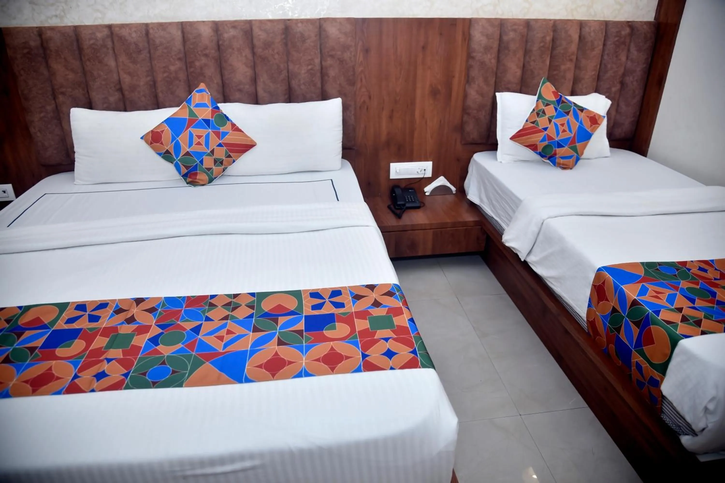 Bed in Hotel Pride Inn