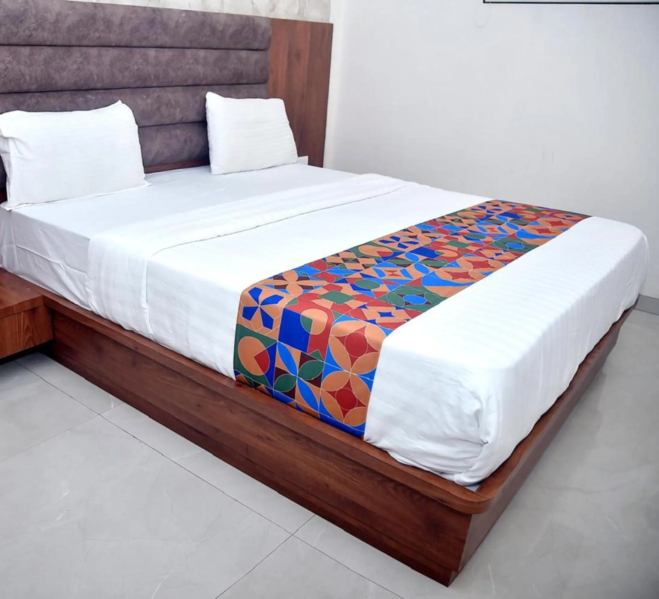 Bed in Hotel Pride Inn