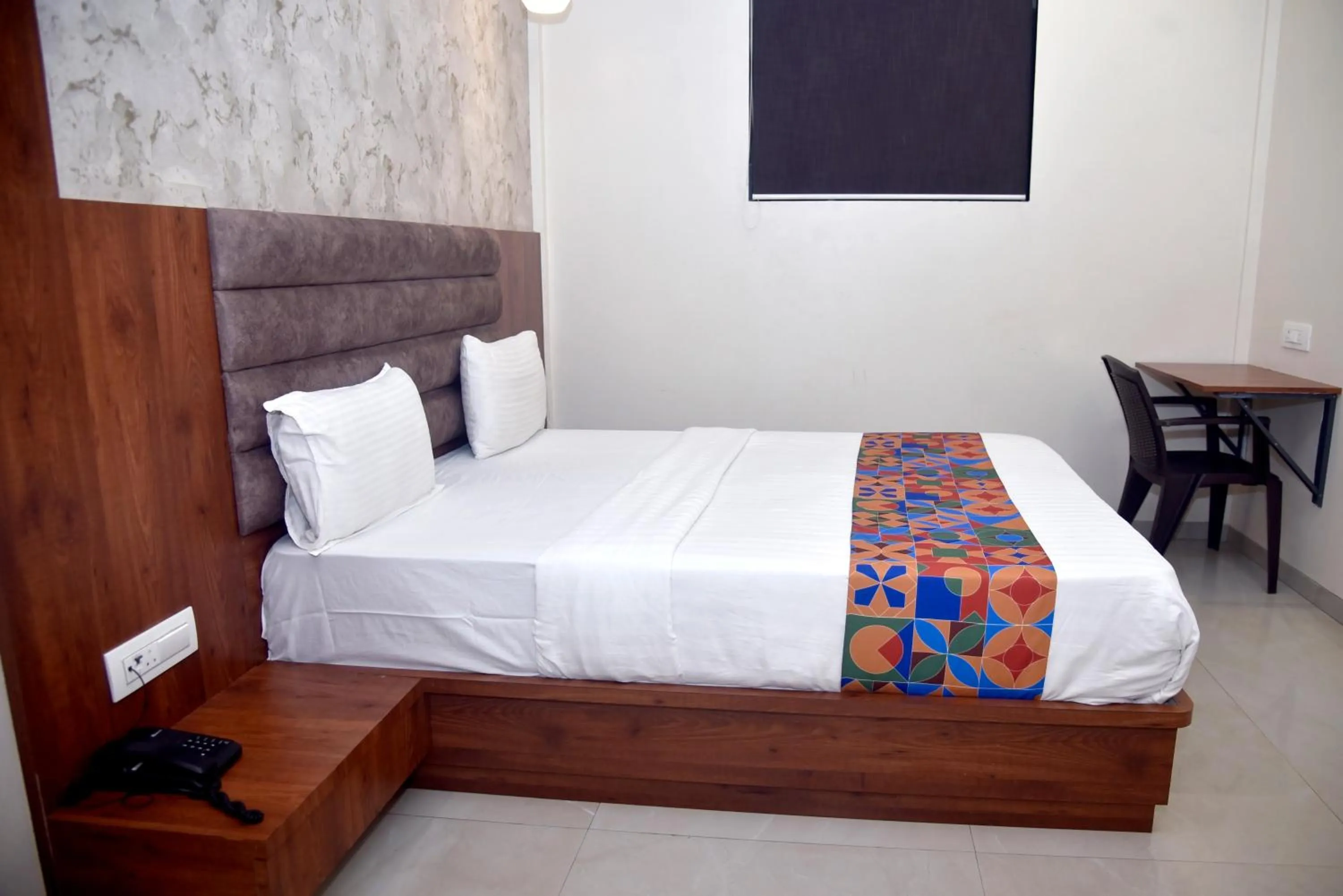 Bed in Hotel Pride Inn