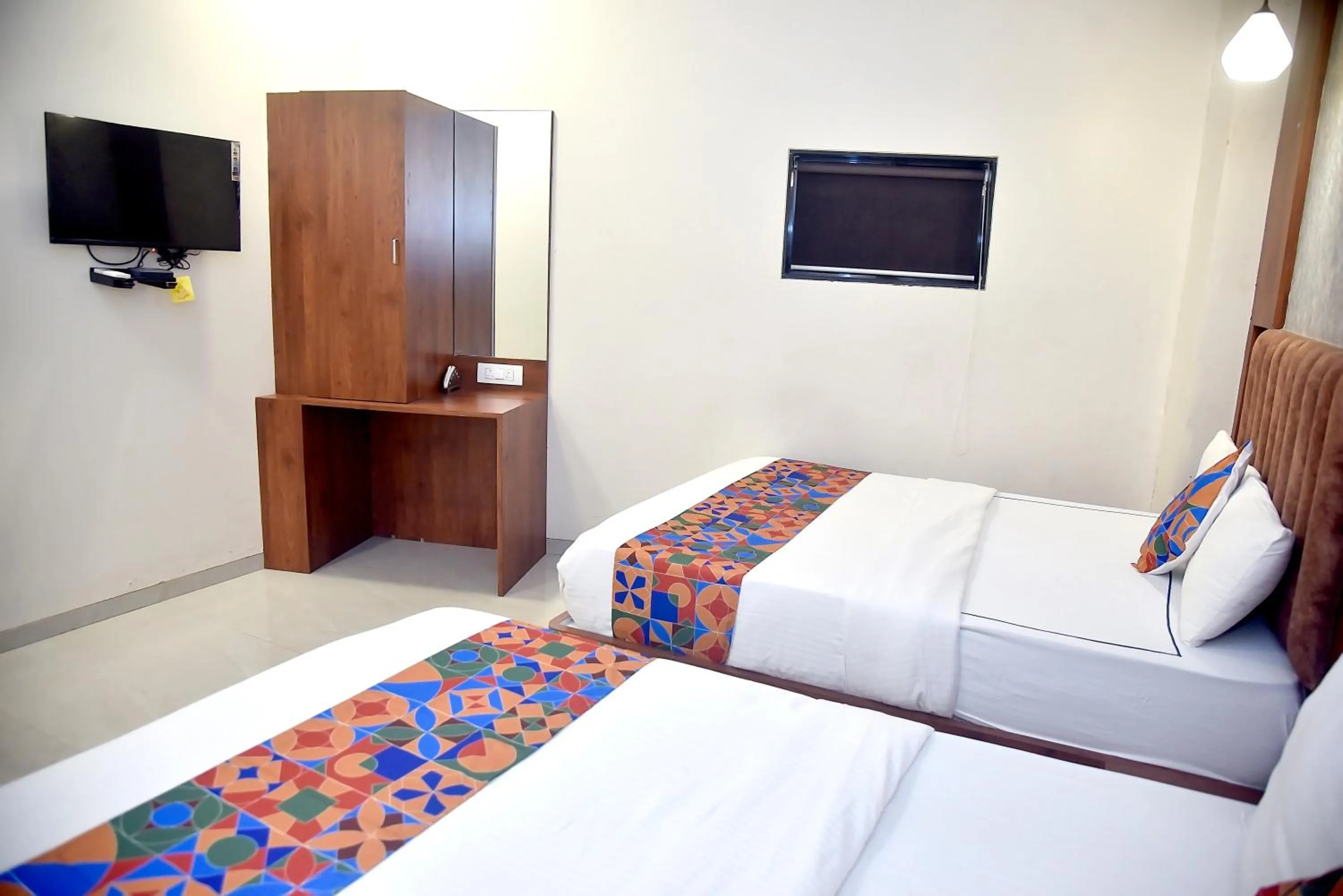 Bedroom in Hotel Pride Inn