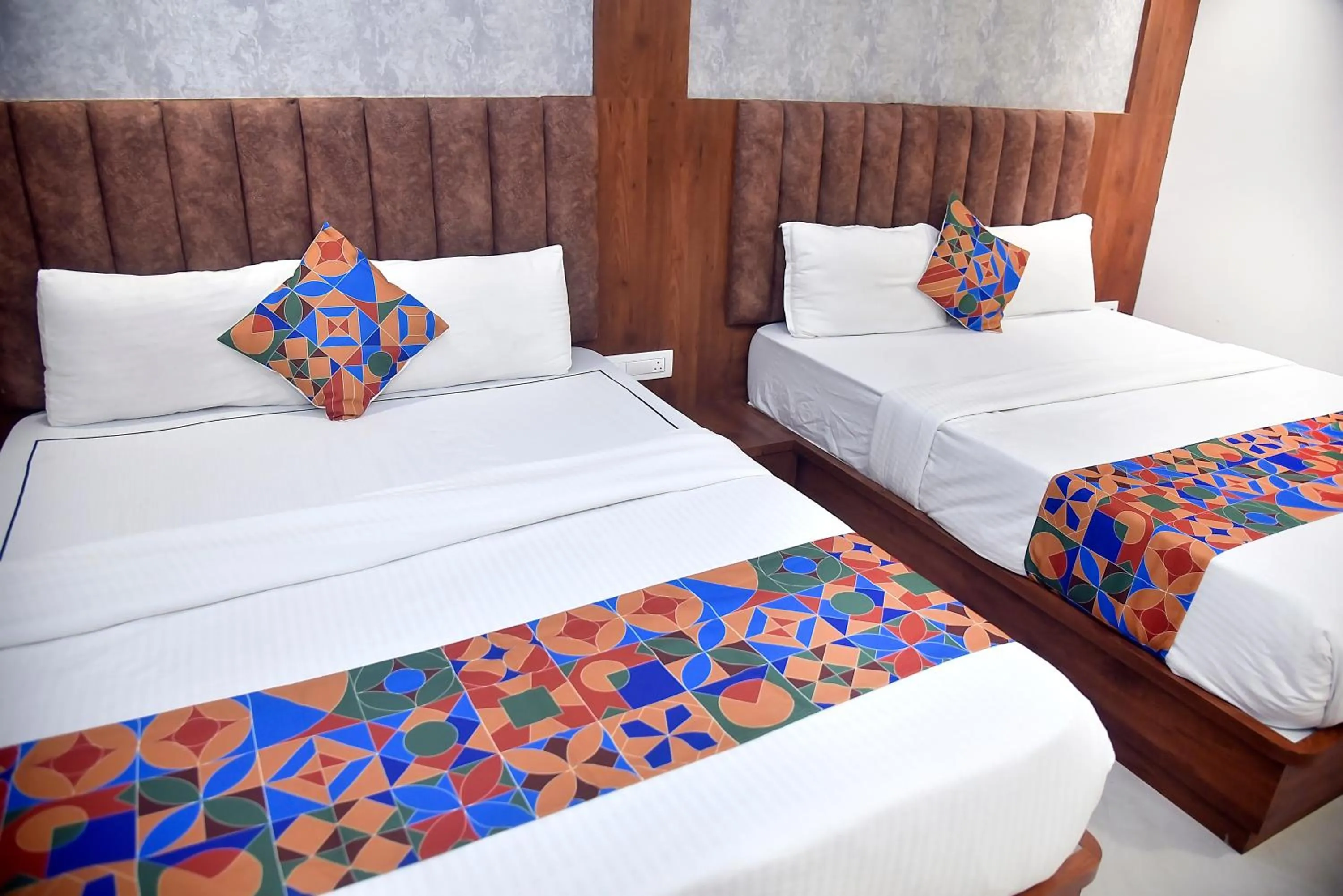 Bed in Hotel Pride Inn