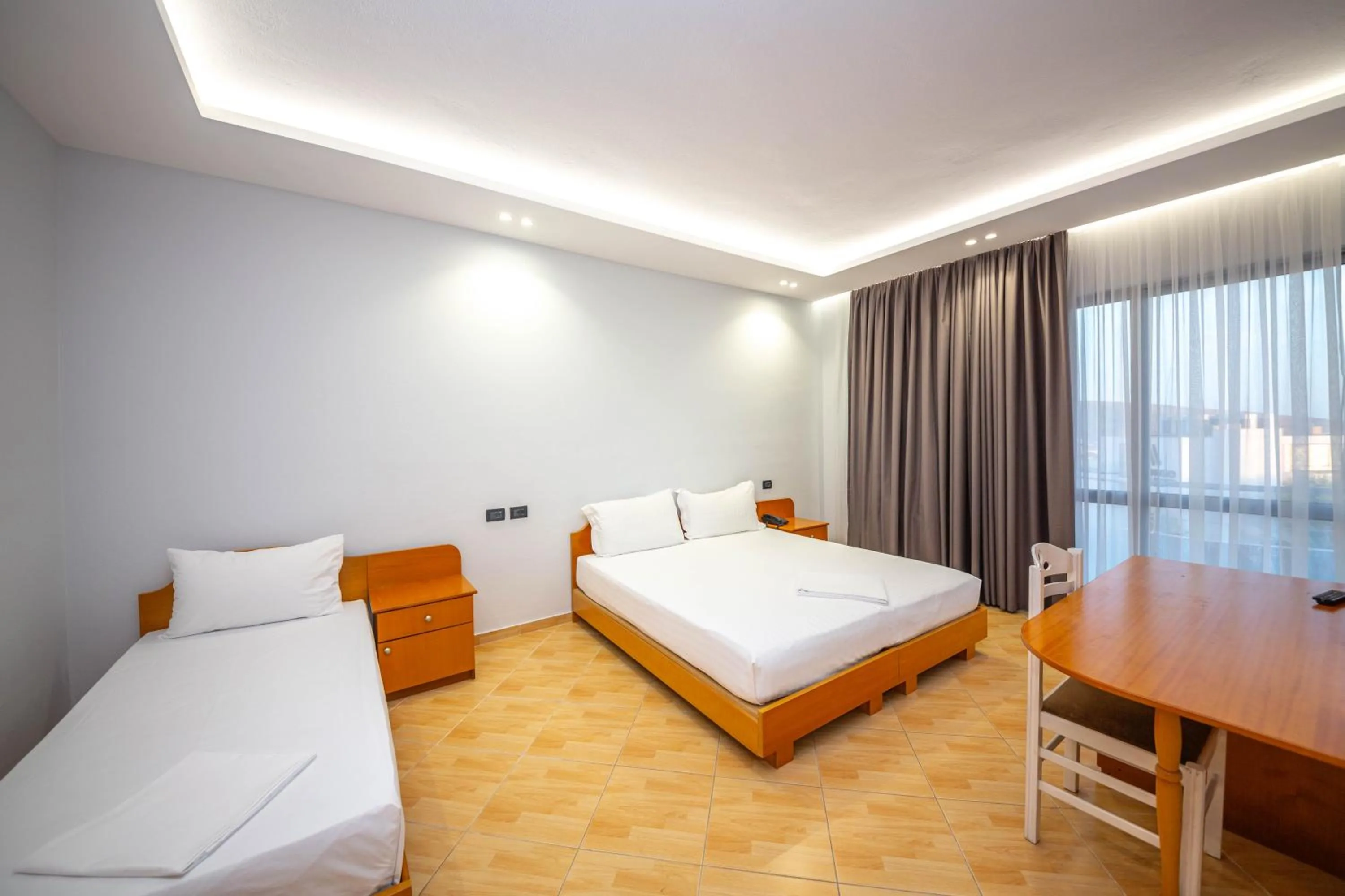 Deluxe Triple Room with Balcony and Side Sea View in Hotel Sea Breeze