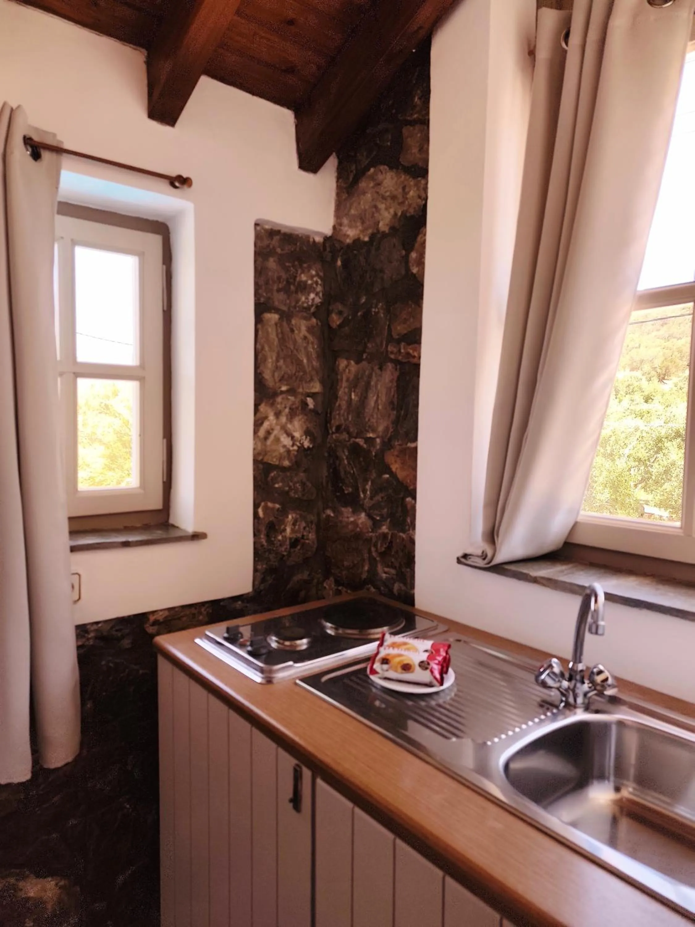 Kitchen or kitchenette in Elia Village by Irida Iris Group