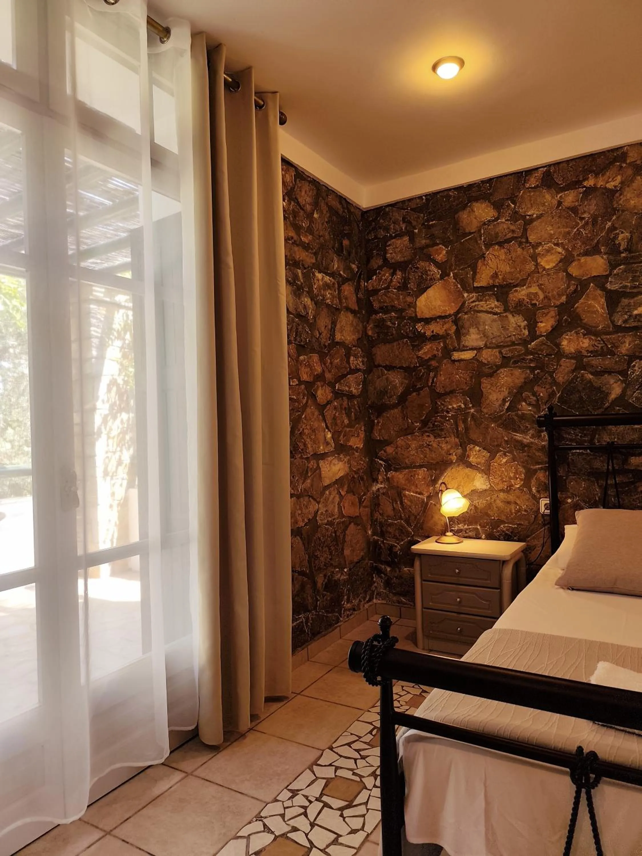 Bed in Elia Village by Irida Iris Group