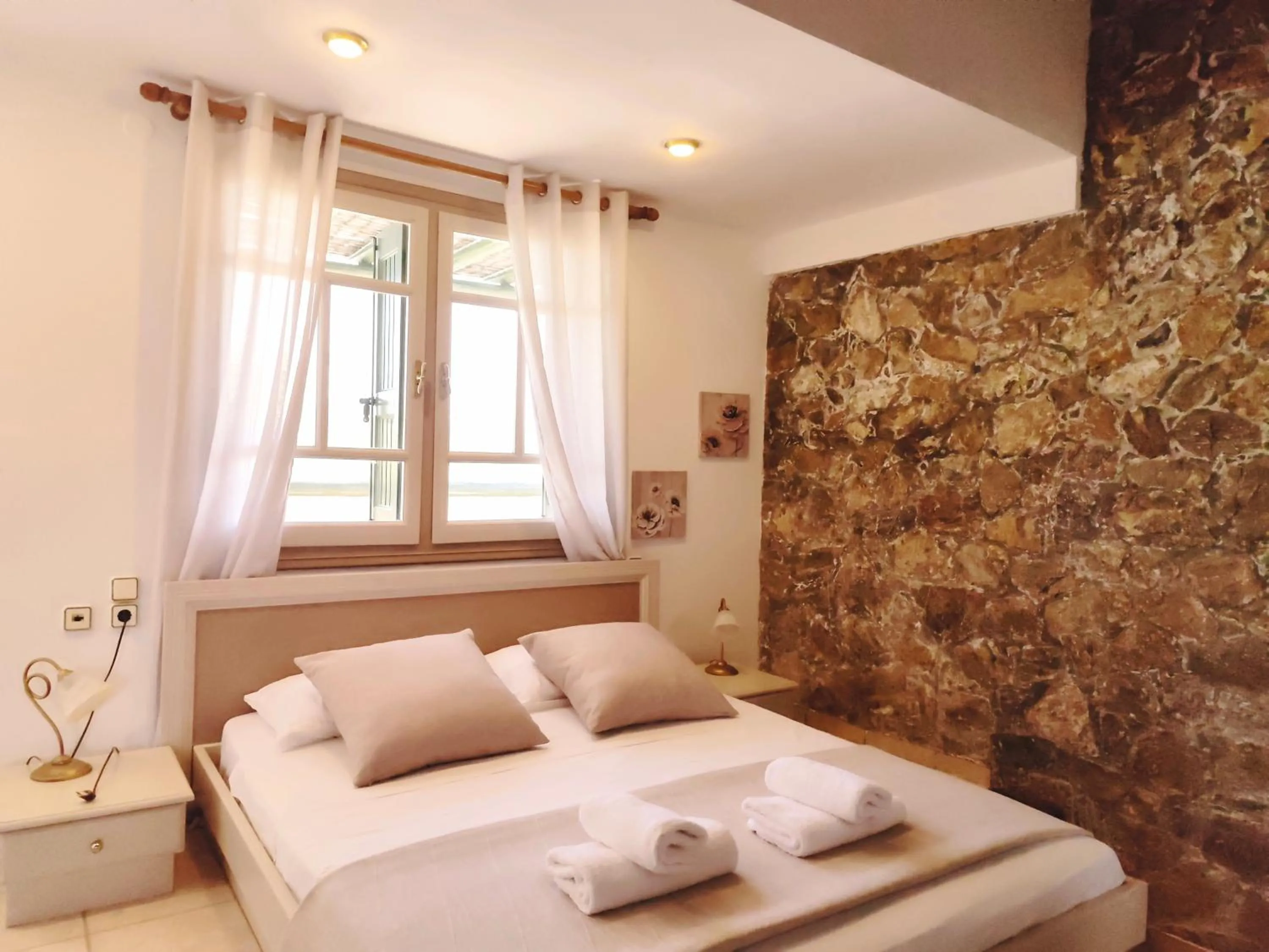 Bed in Elia Village by Irida Iris Group