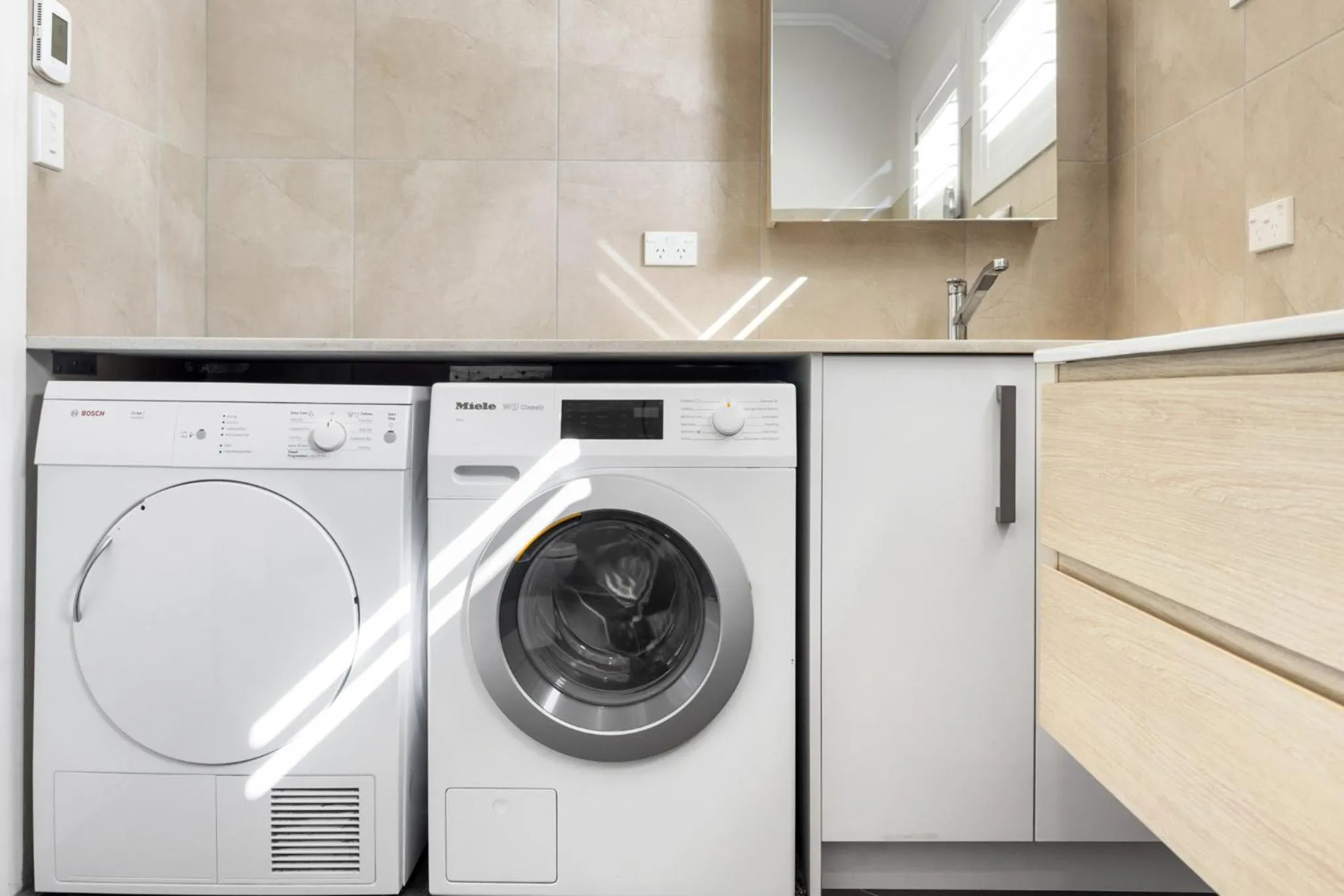 washing machine in Freemans Bay Home by Urban Rest