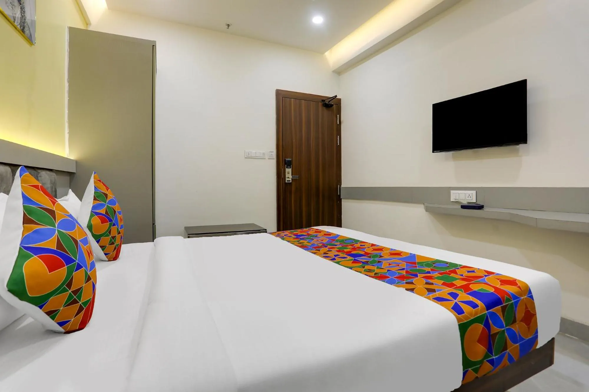 Bed in FabHotel Prime Panchwati Regency