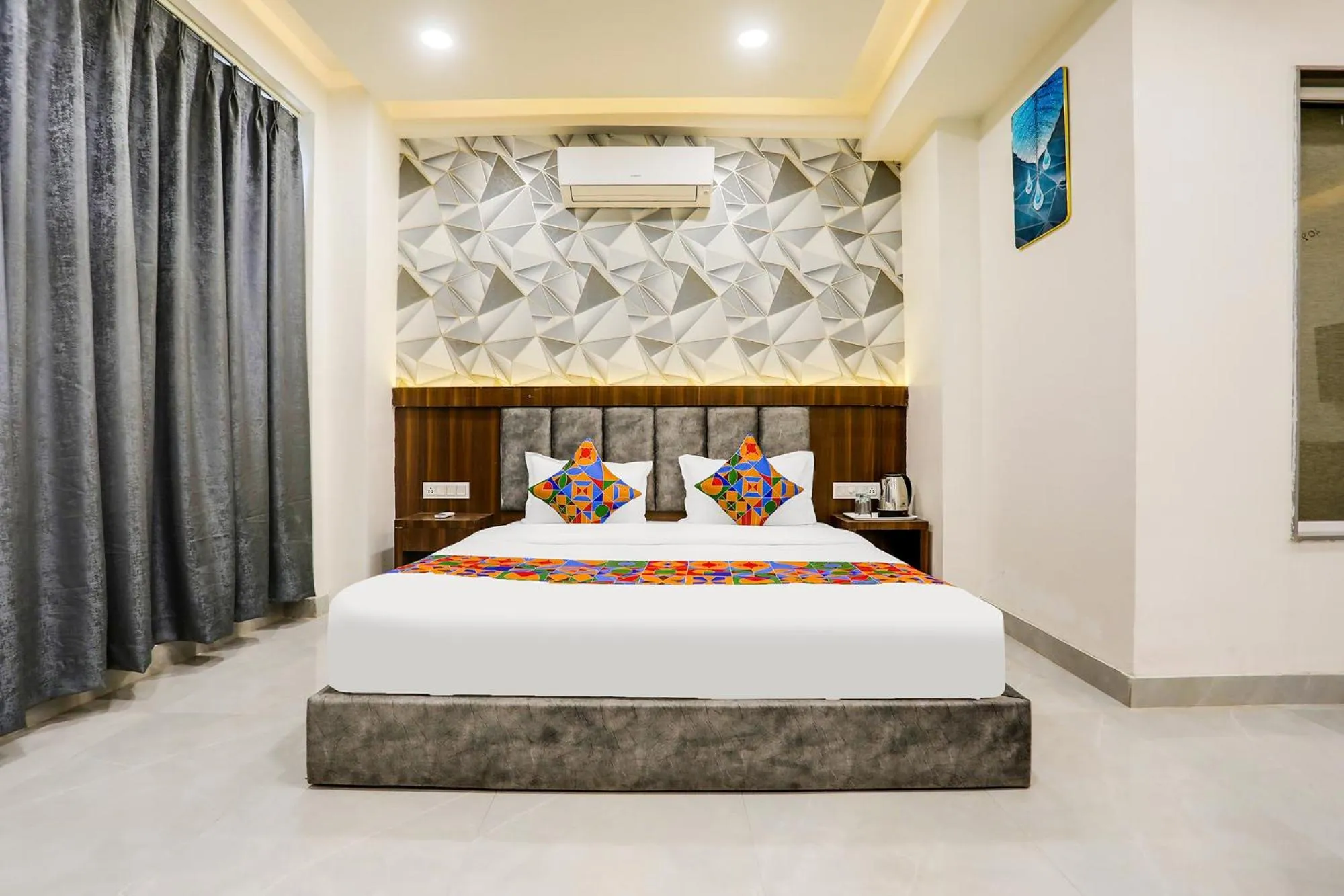 Bed in FabHotel Prime Panchwati Regency