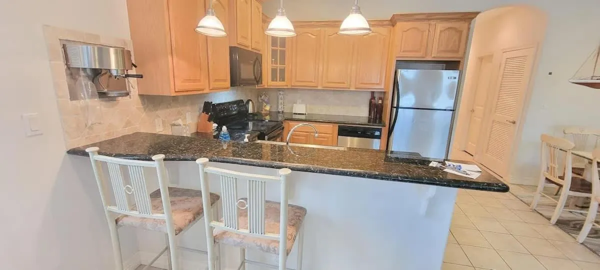 Kitchen or kitchenette in Beach & Palms condo