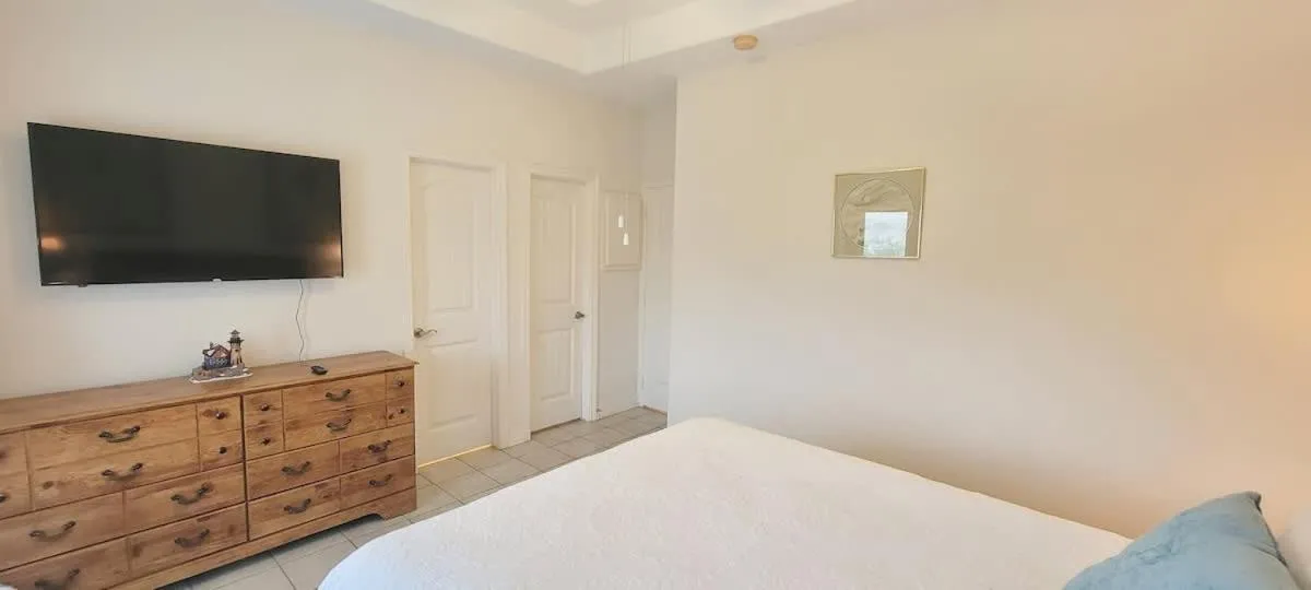 Bed in Beach & Palms condo