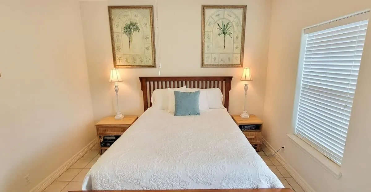 Bed in Beach & Palms condo