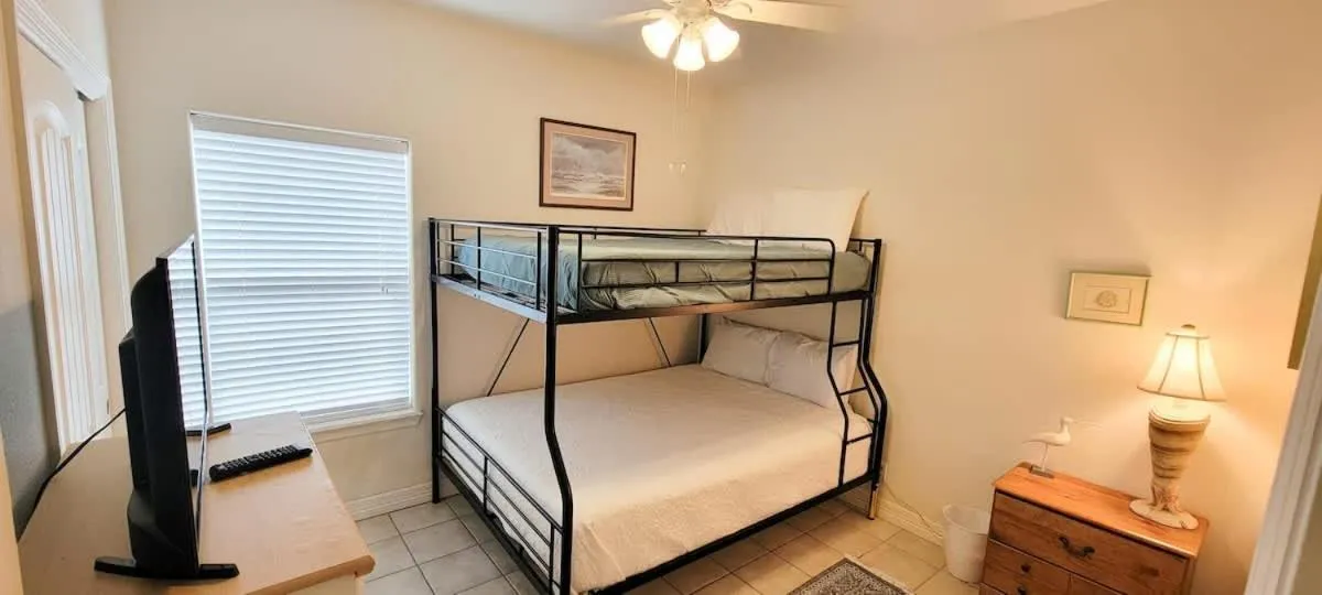 Bed in Beach & Palms condo