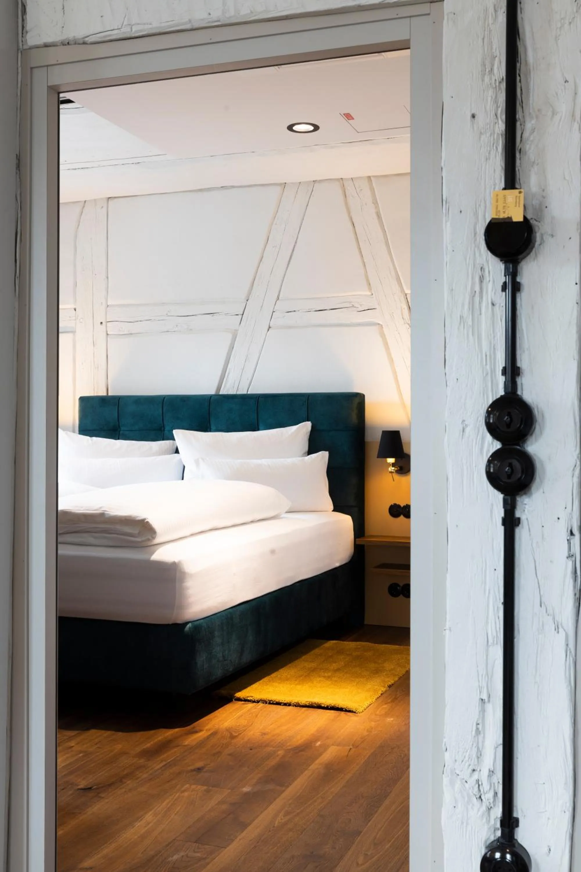 Bed in Das Goldschläger Boutique Hotel