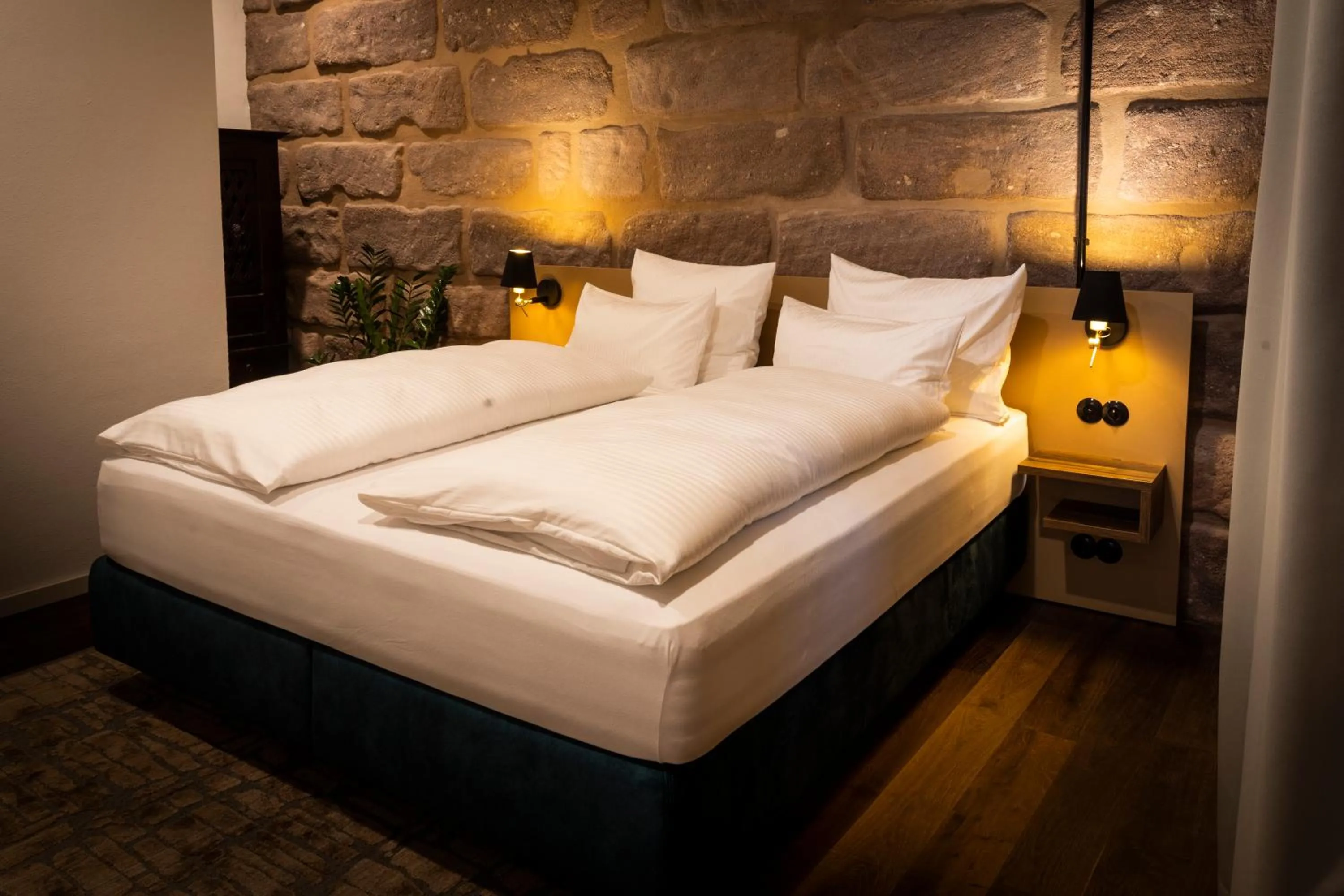 Bed in Das Goldschläger Boutique Hotel
