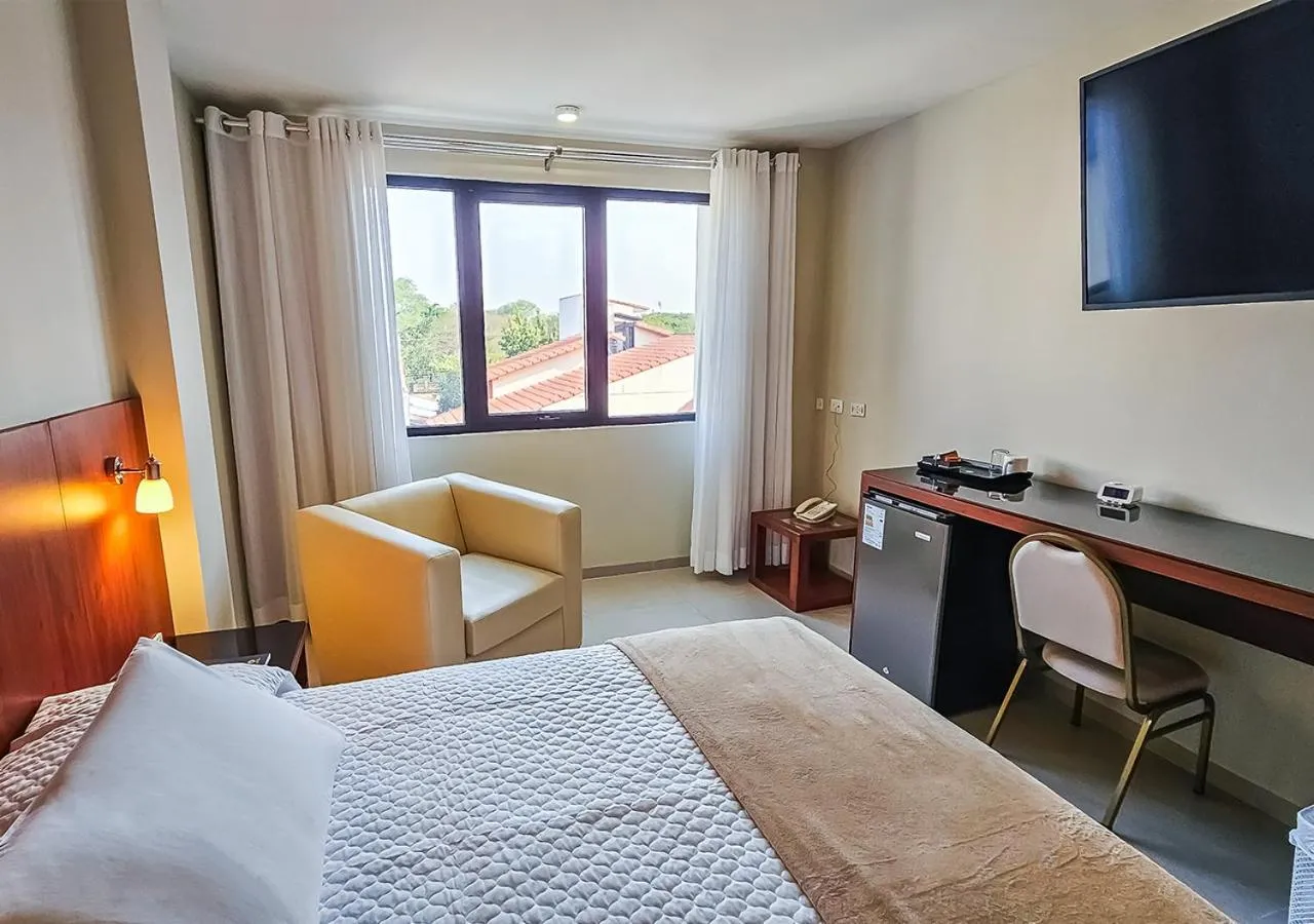 Communal lounge/ TV room, Bed in Hotel Maywa