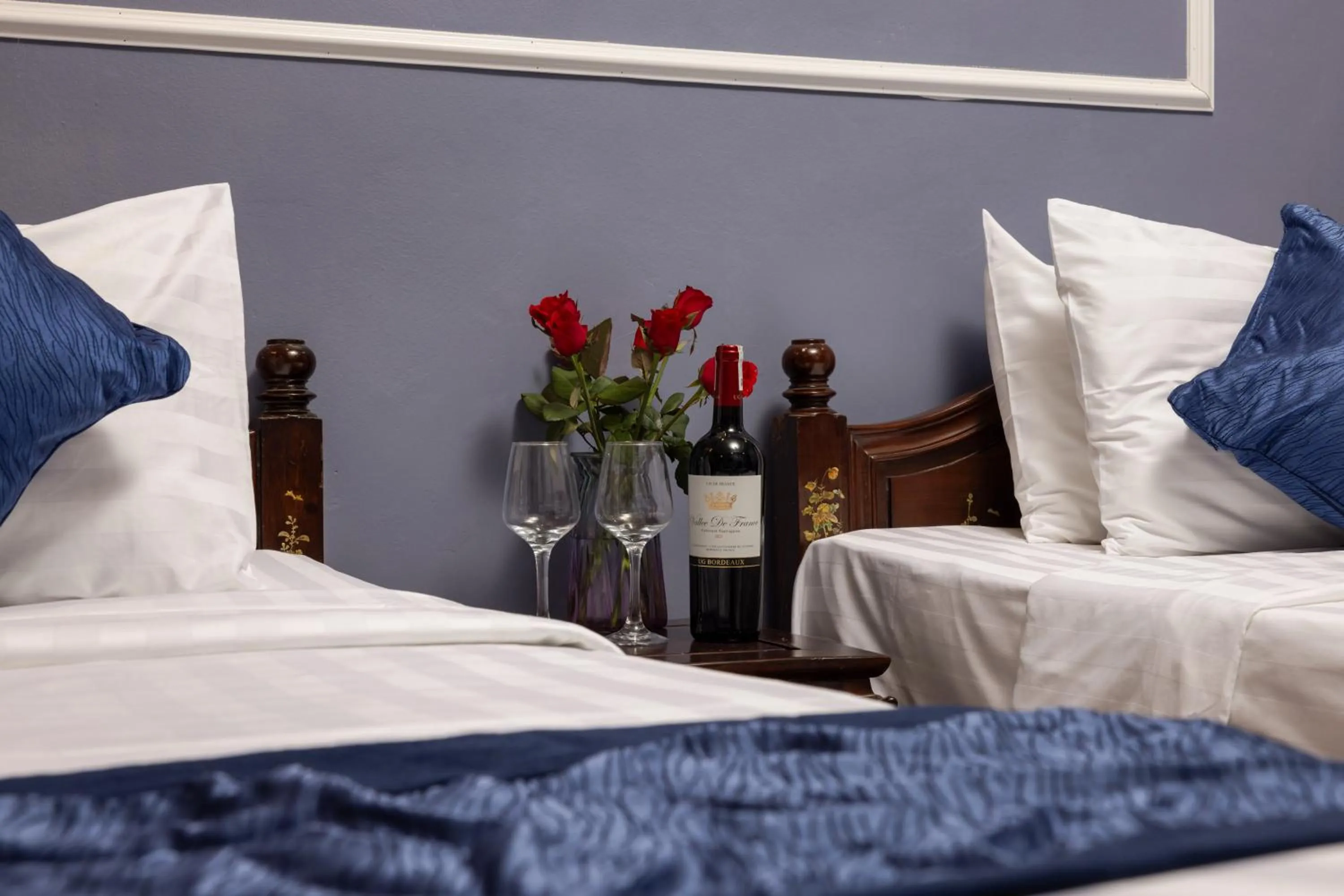 Bed in Amanda Boutique Hotel & Travel