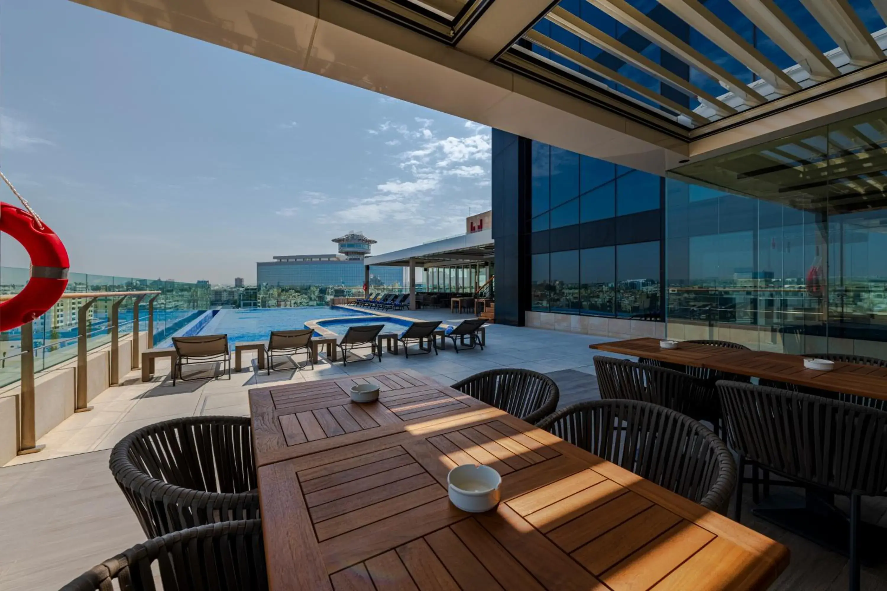 Pool view in Millennium Al Masar Pool view in Millennium Al Masar